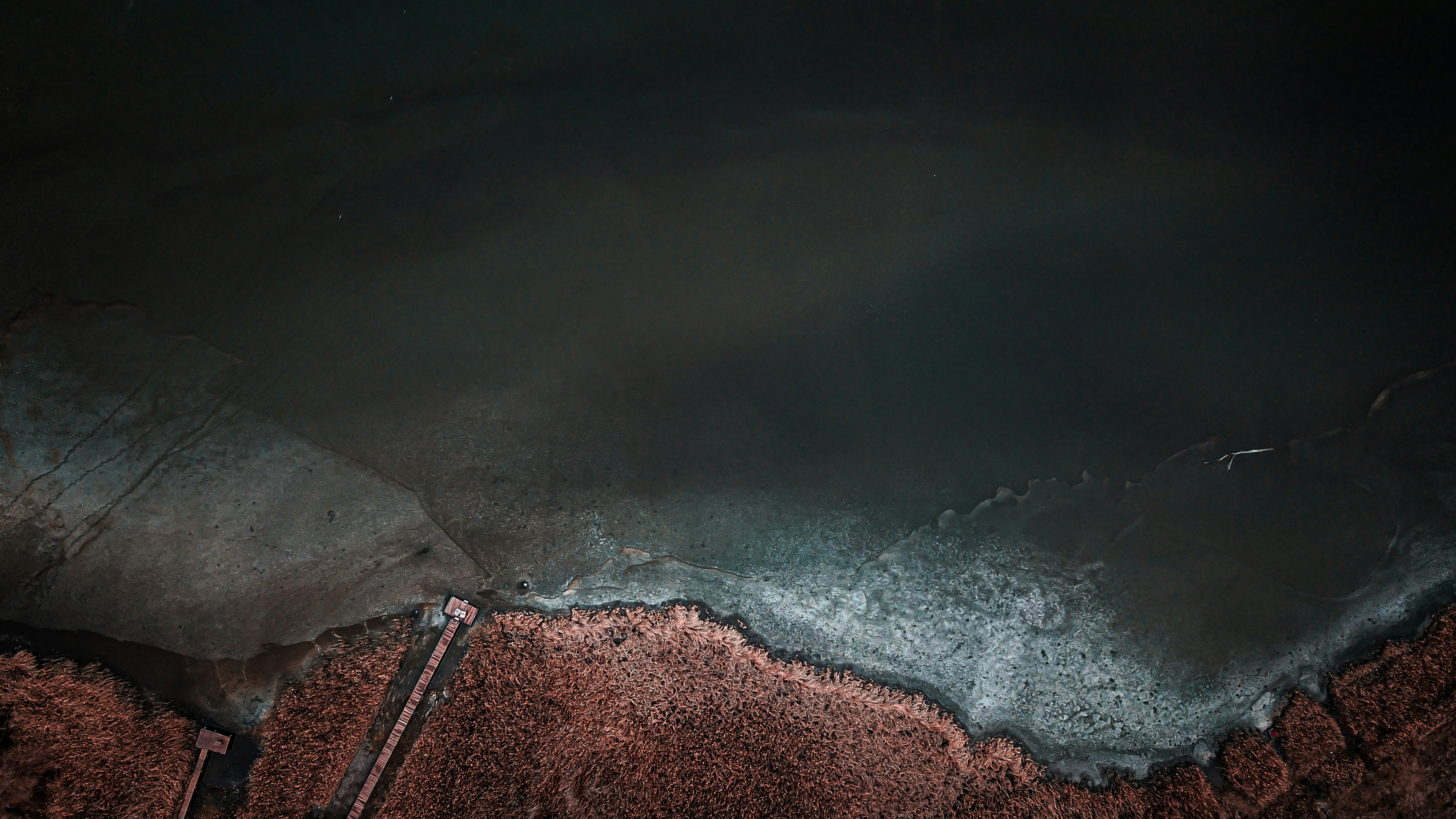 Aerial View of Partially Frozen Lake