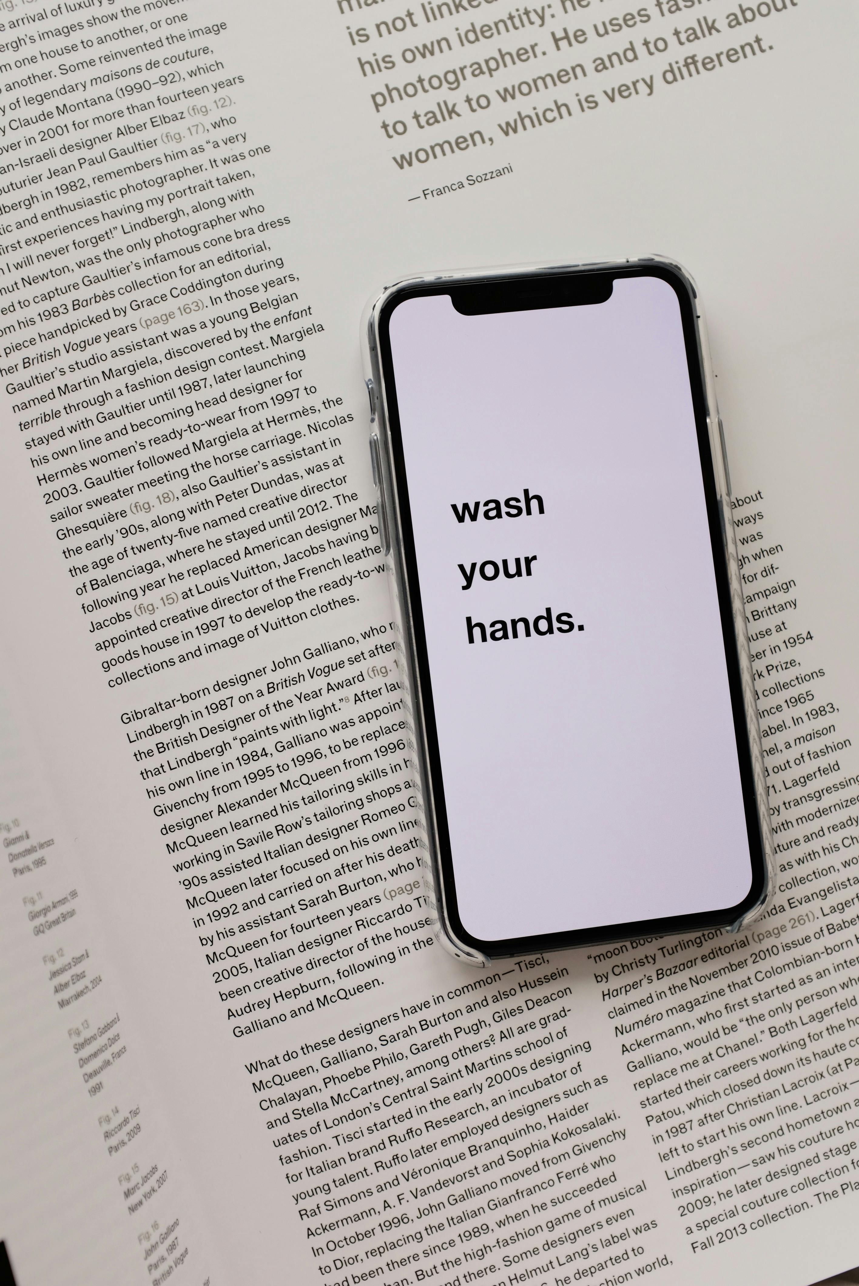 Smartphone Showing Wash Your Hands On Open Book