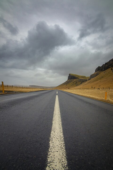 Empty Highway Through Grass Hills