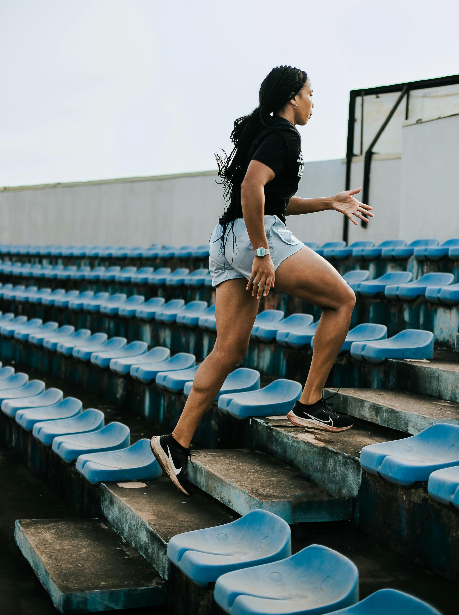 Woman Running Stadium Stairs Workout
