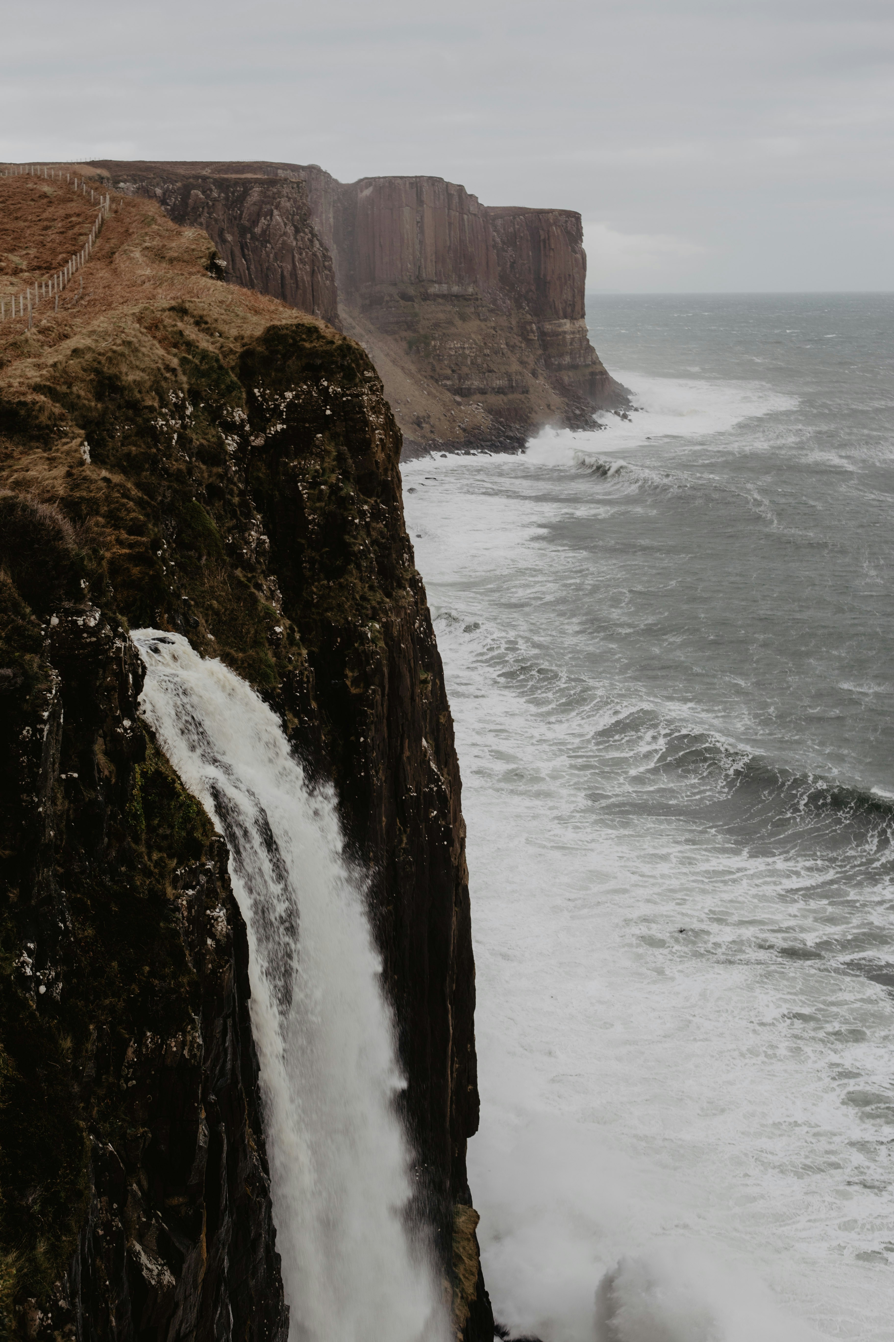 Cliff Waterfall Flowing Into Sea