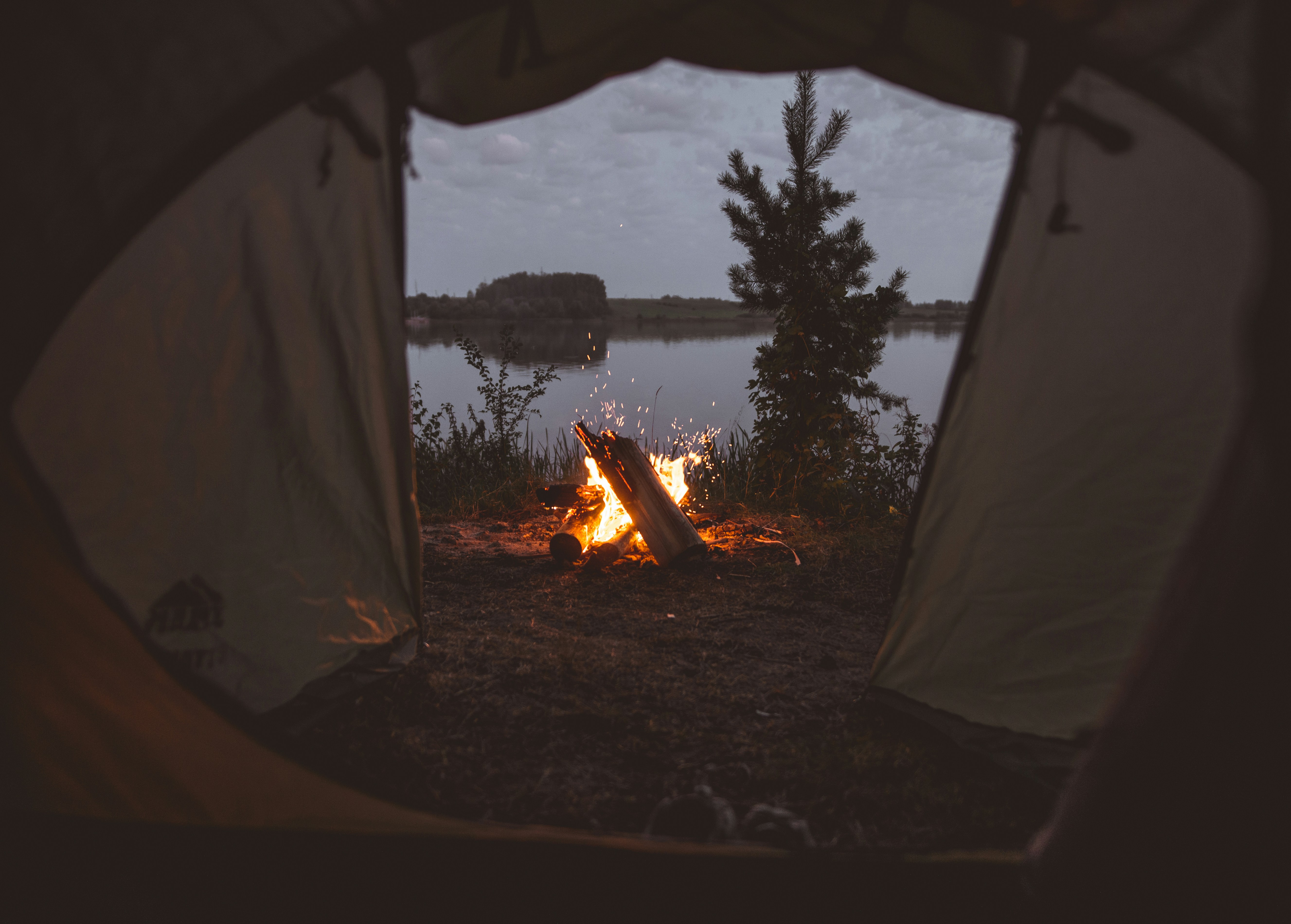 Campfire View From Tent By Lake