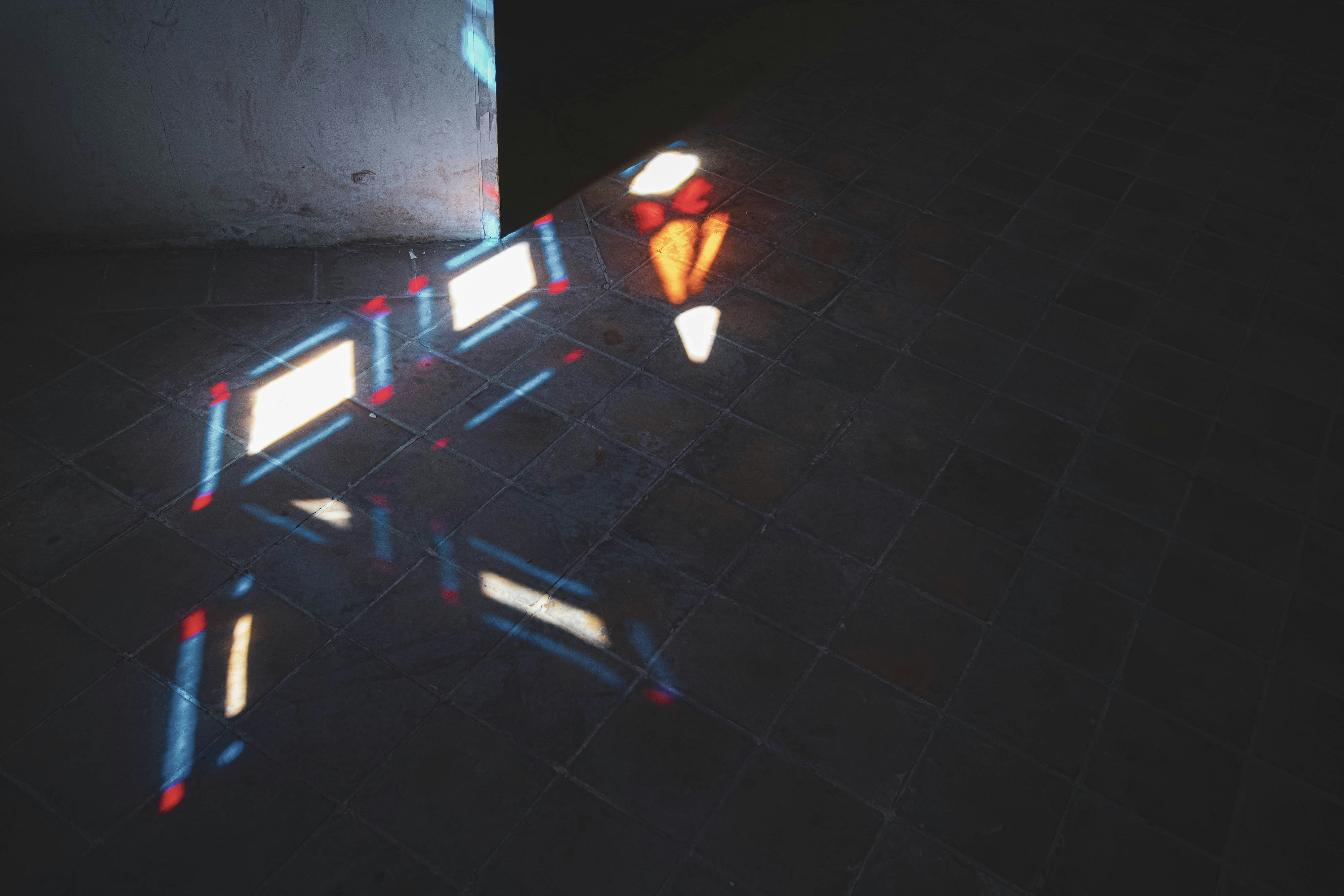 Colored Light Refraction on Tiled Floor