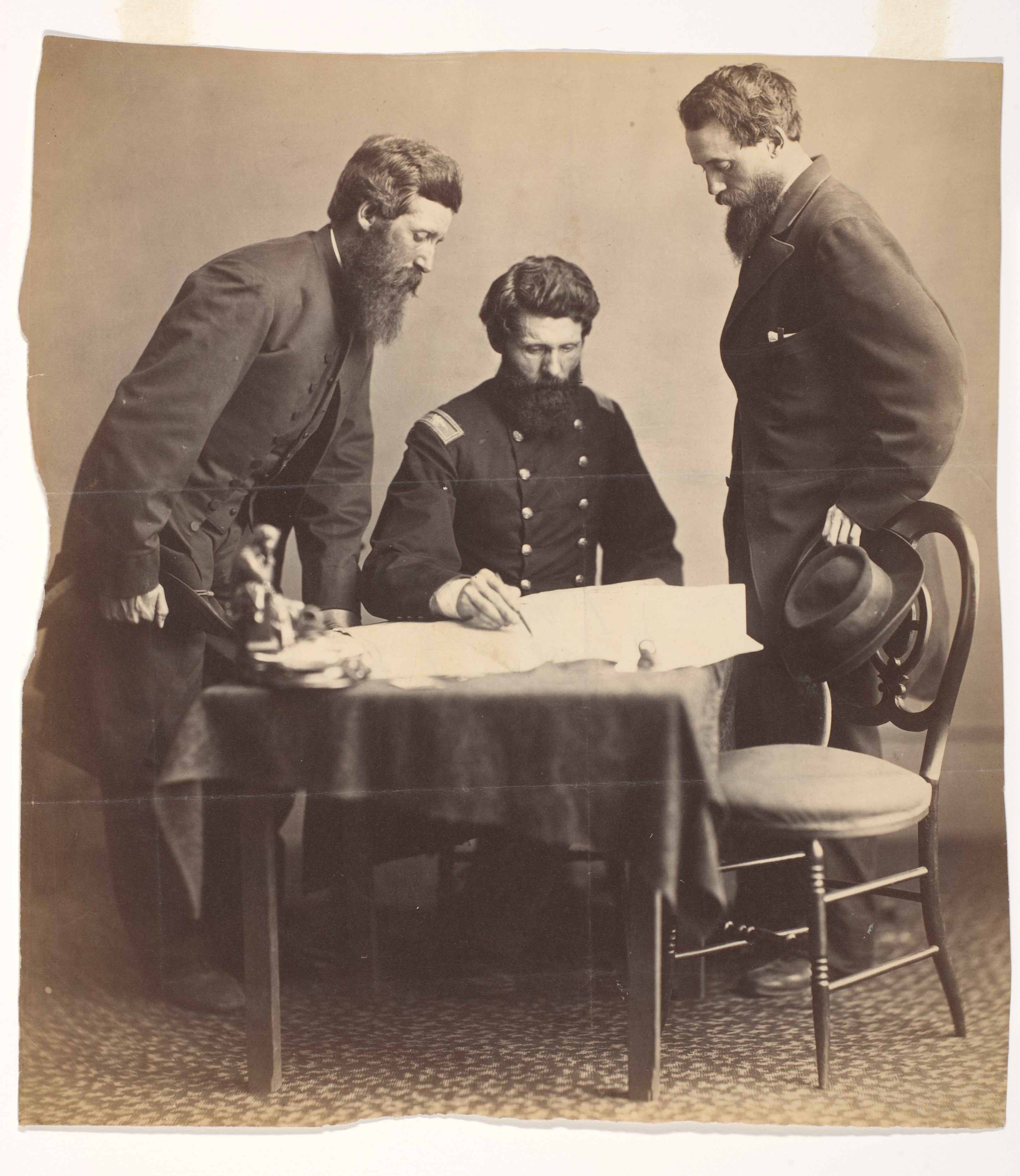 Three Men Studying a Map Old Photograph