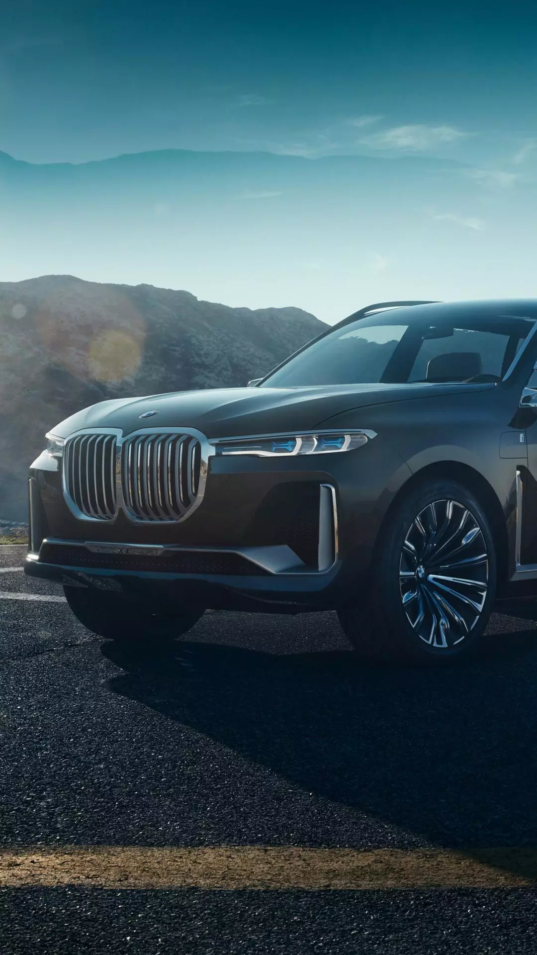 Black BMW SUV on Mountain Road