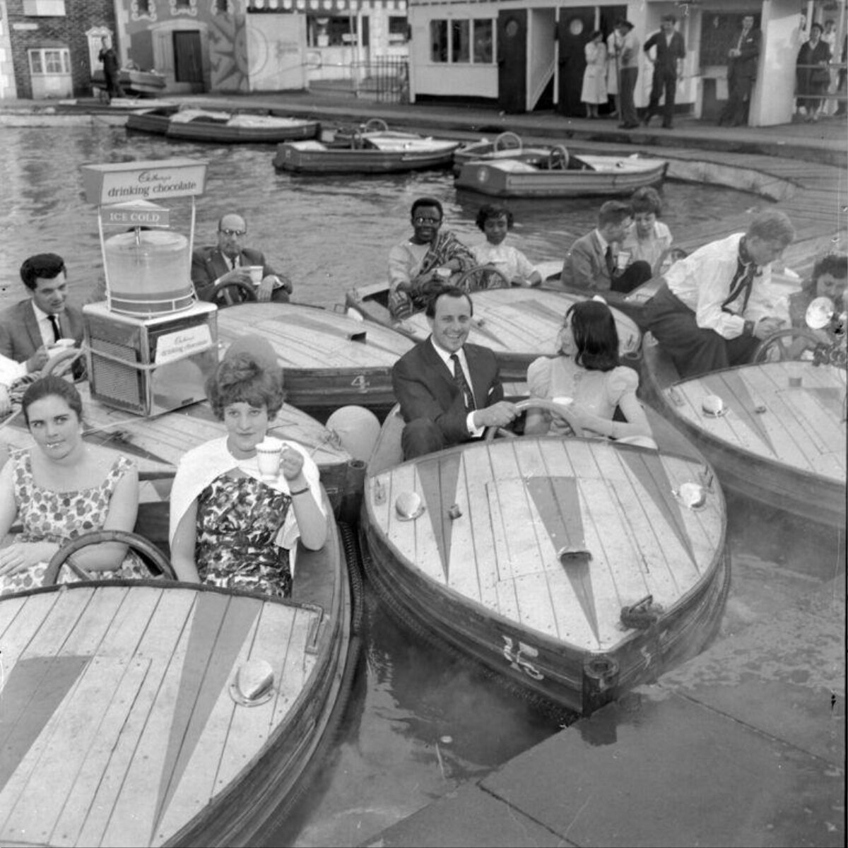 Vintage recreational boating on park lake