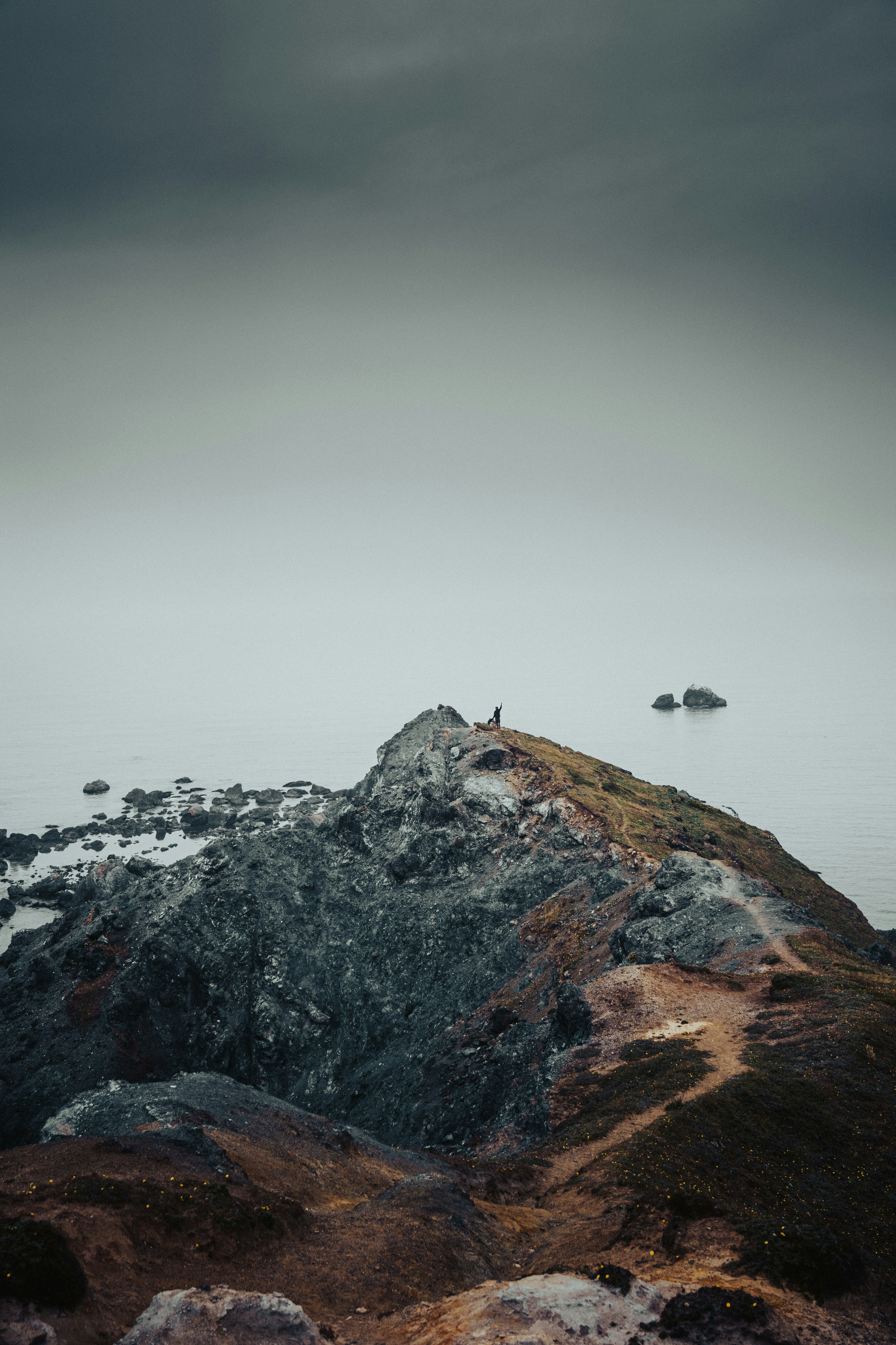 Lone Hiker on Coastal Headland