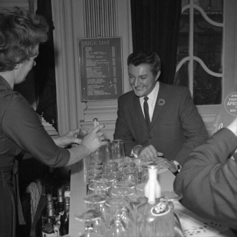Smiling Man At Vintage Bar Counter