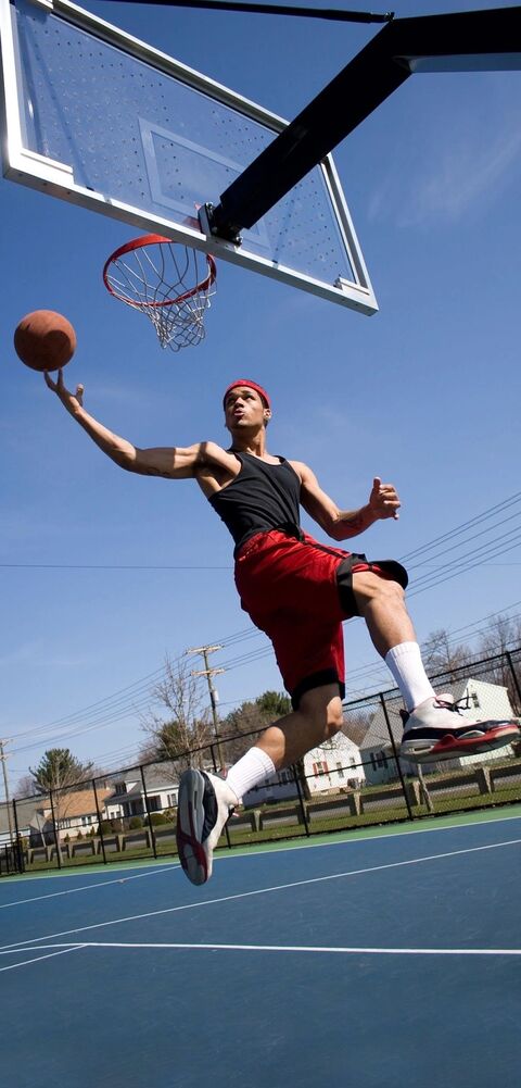 Basketball Player Going for a Dunk