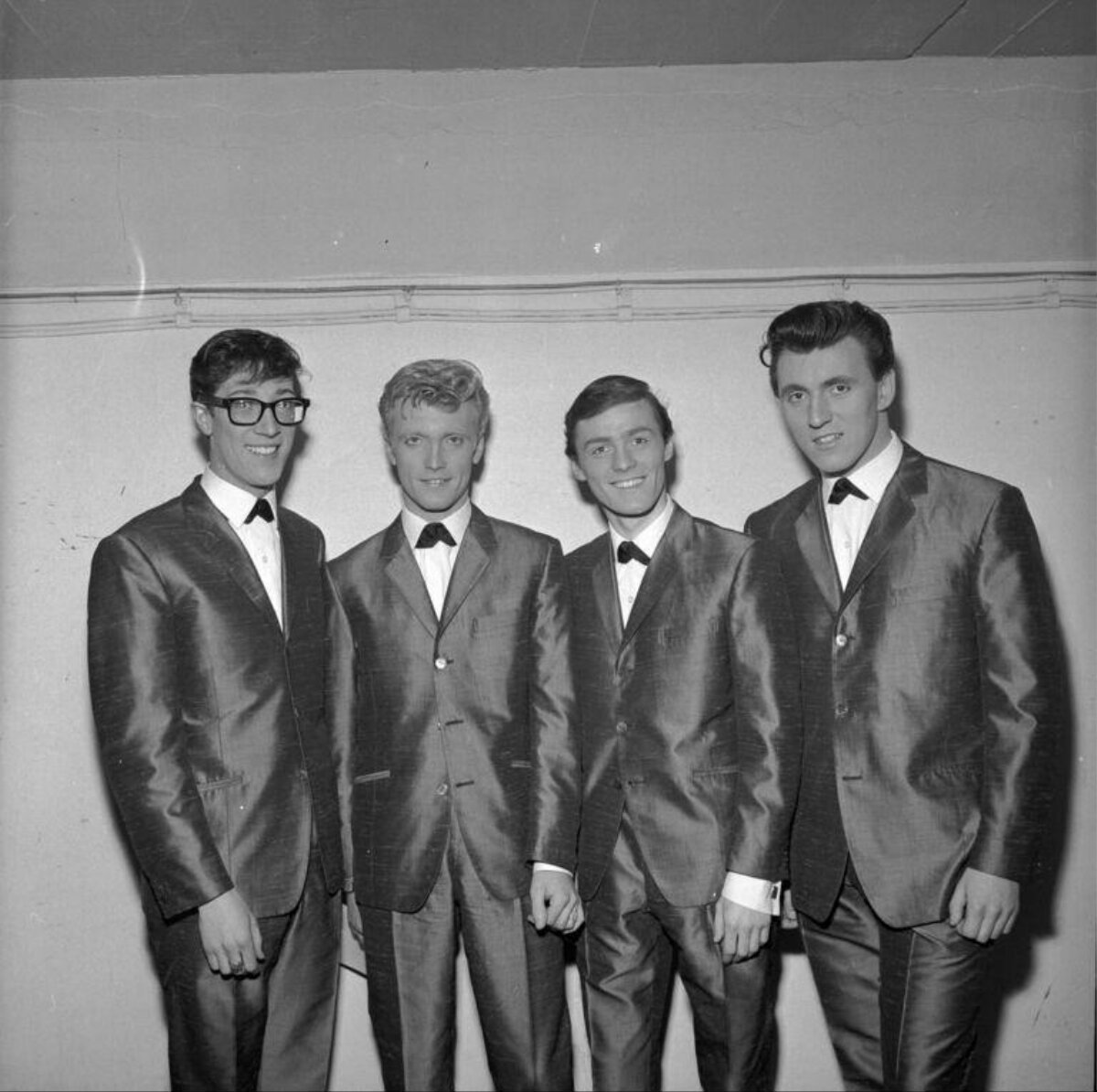 Four Men in Matching Formal Suits