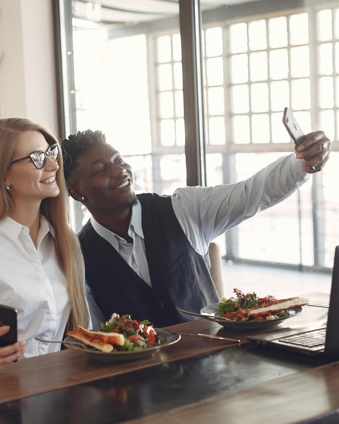 Two People Taking Selfie At Restaurant Lunch