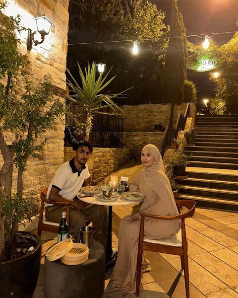 Couple Dining at Outdoor Night Restaurant