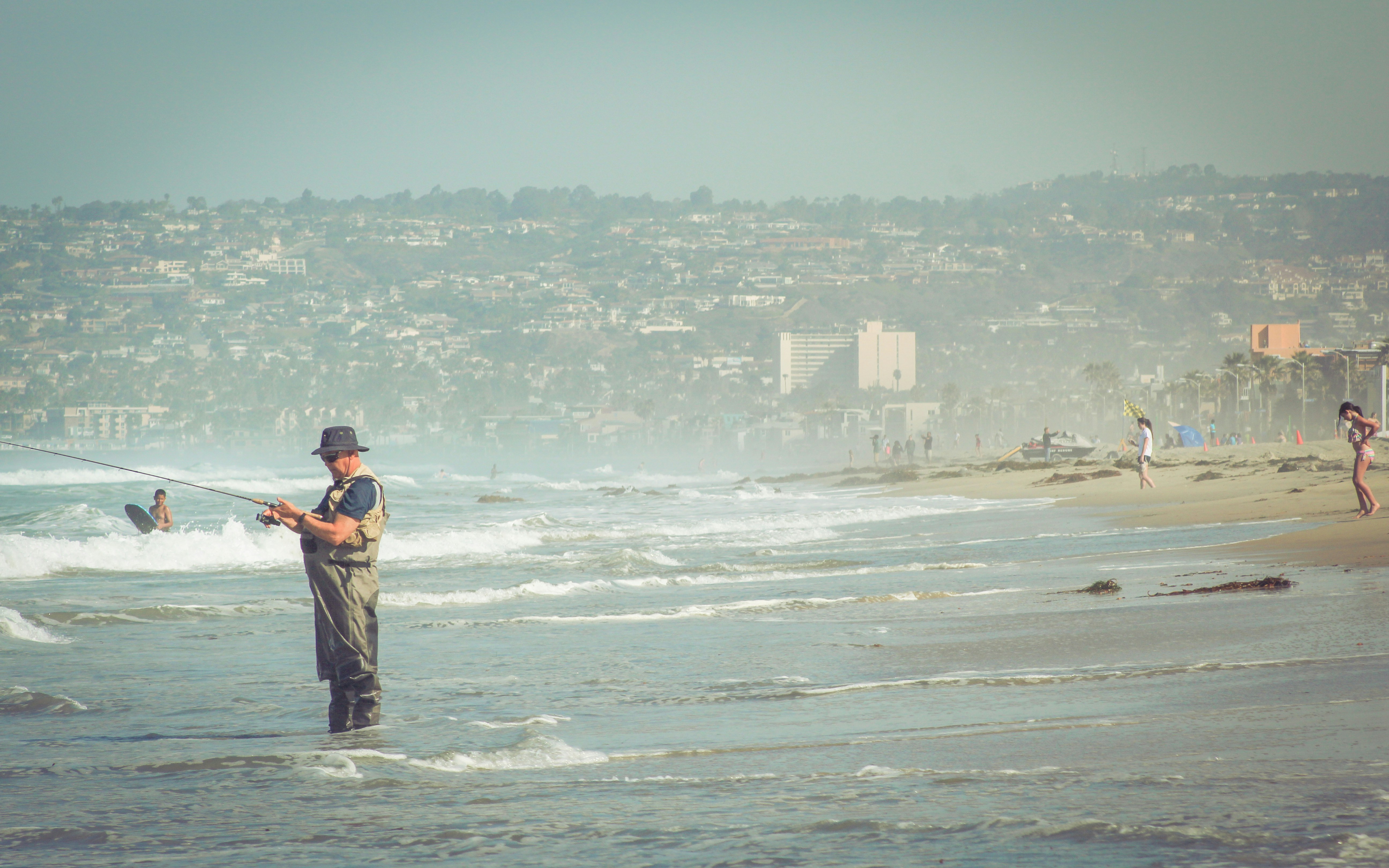 Man Fishing at Coastal Beach