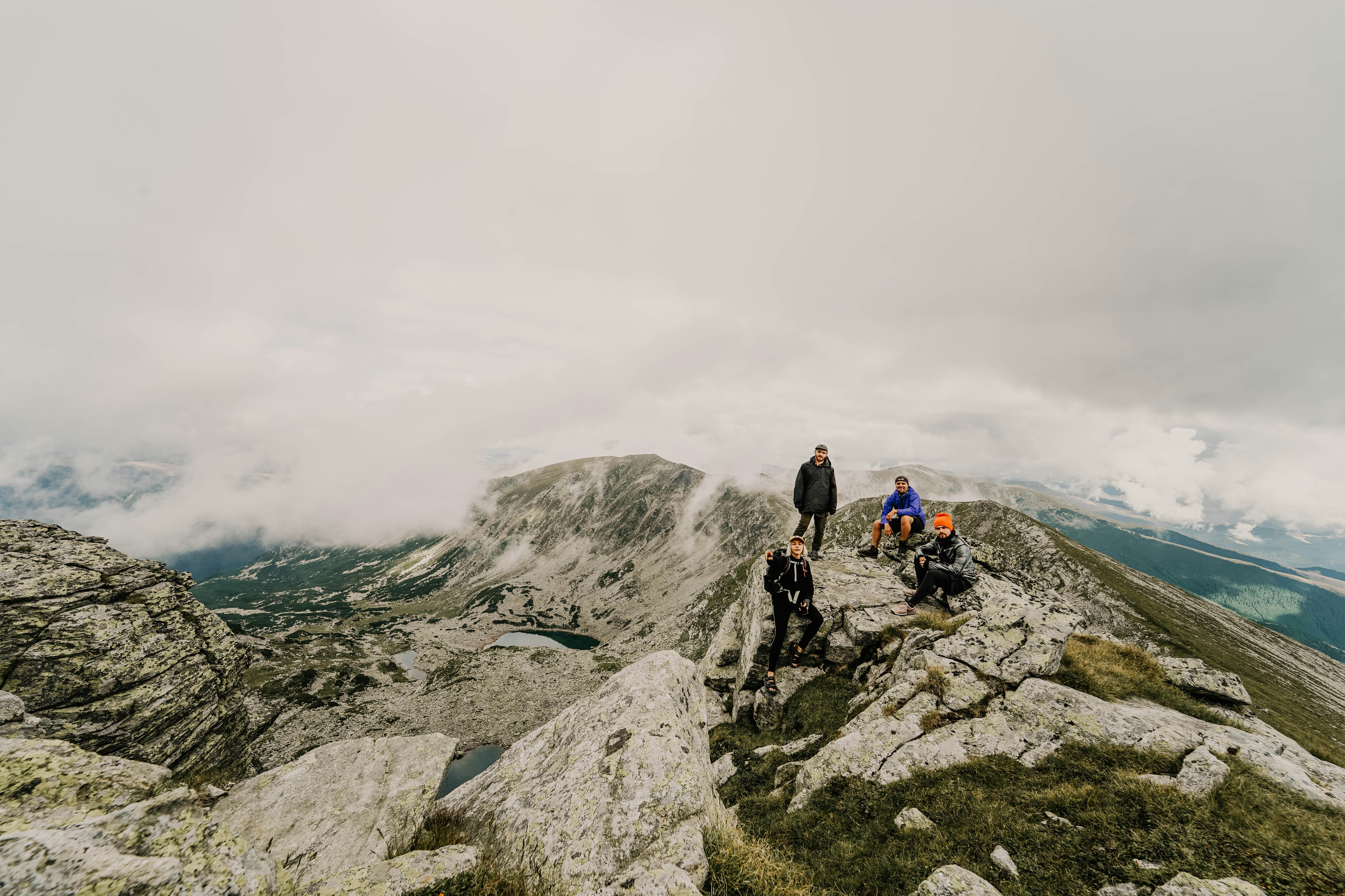 Four Hikers on Mountain Peak