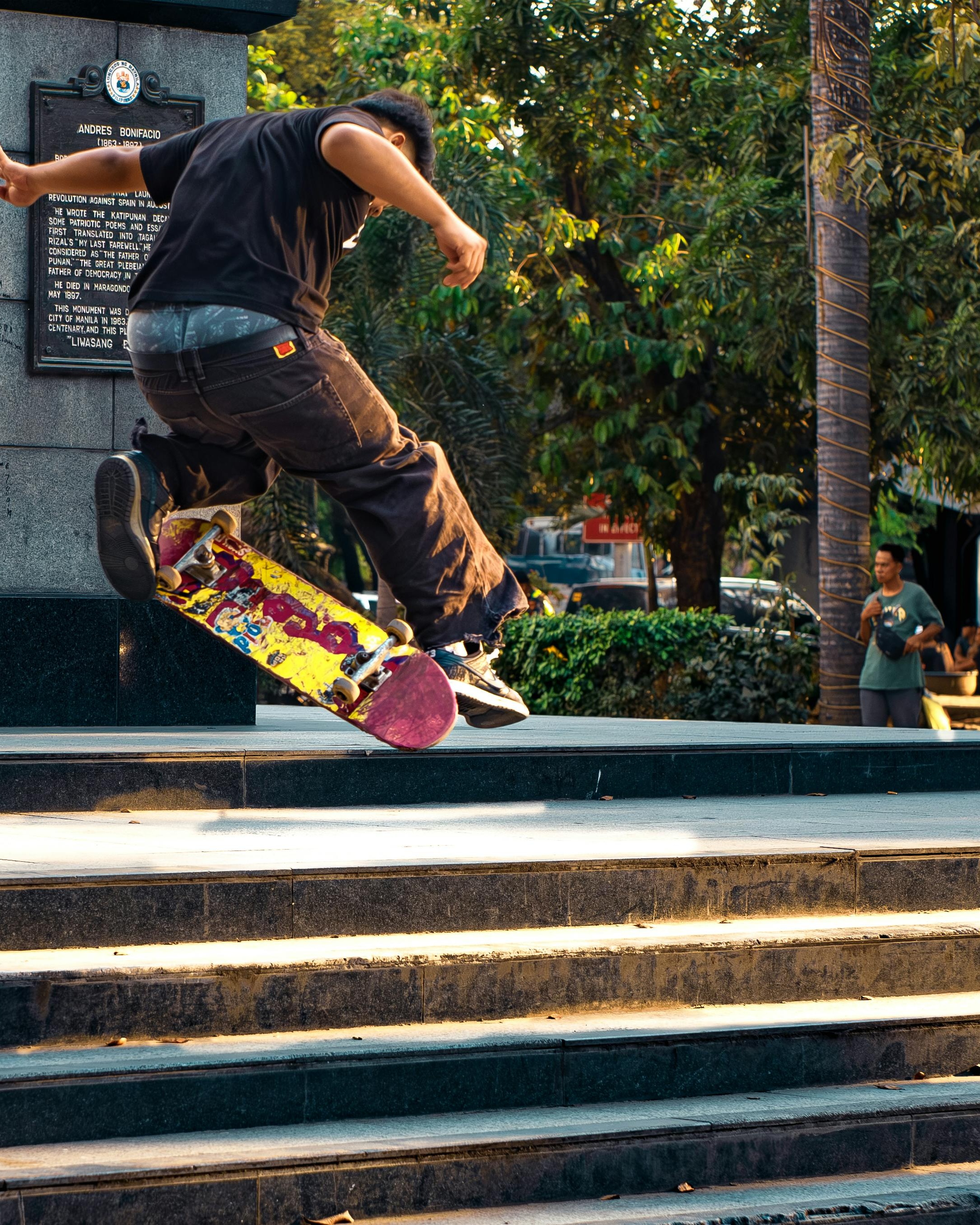 Skateboarder Doing Trick Down Stairs