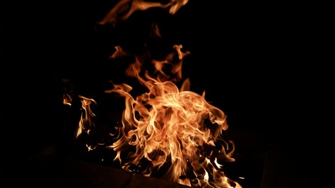 Burning Fire Against Black Background