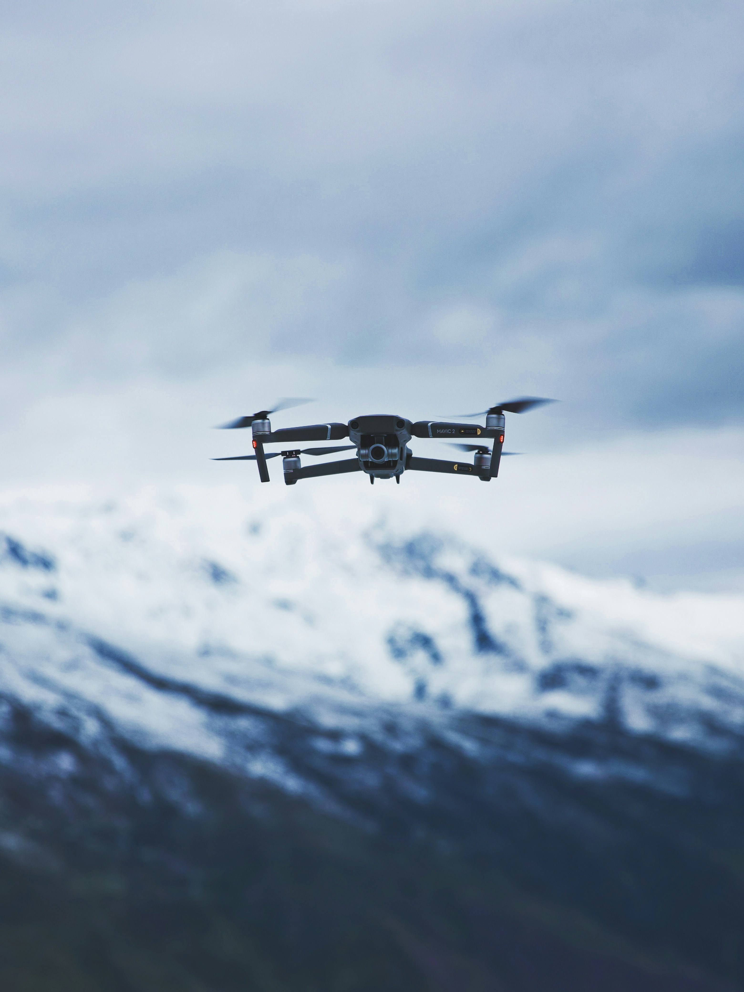 Drone Flying Over Snowy Mountains