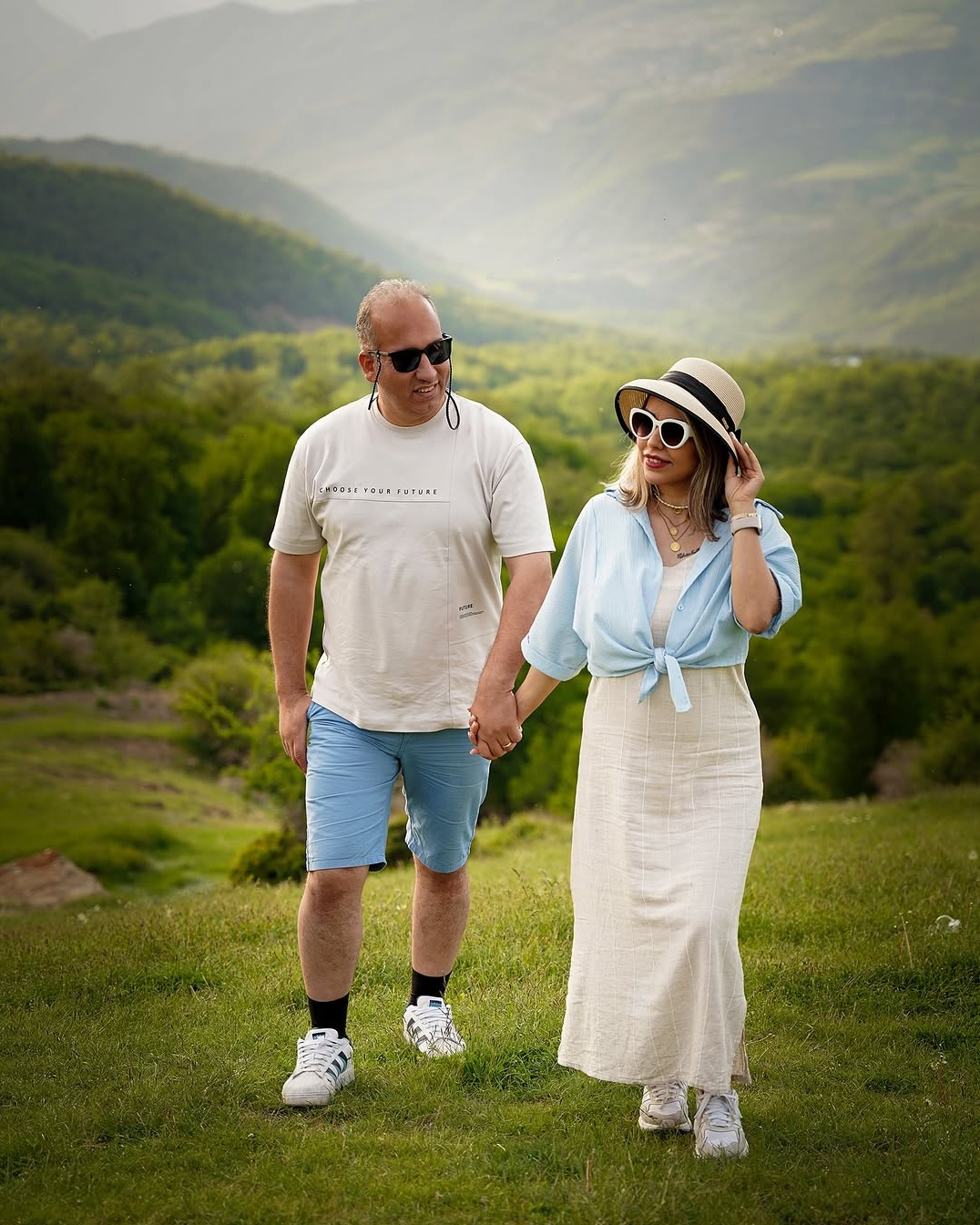 Couple Walking in Mountain Meadow