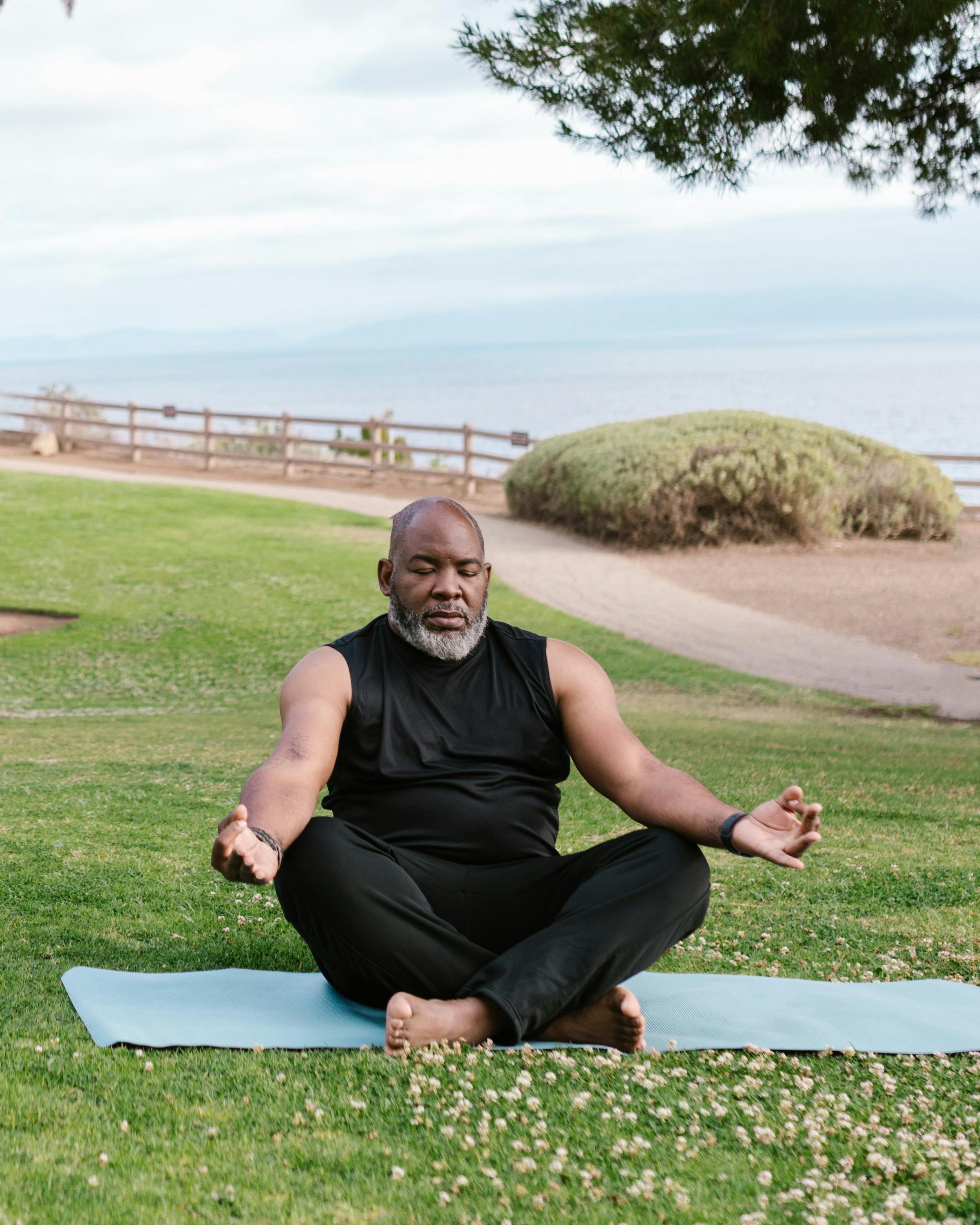 Man Meditating Outdoors by Coast