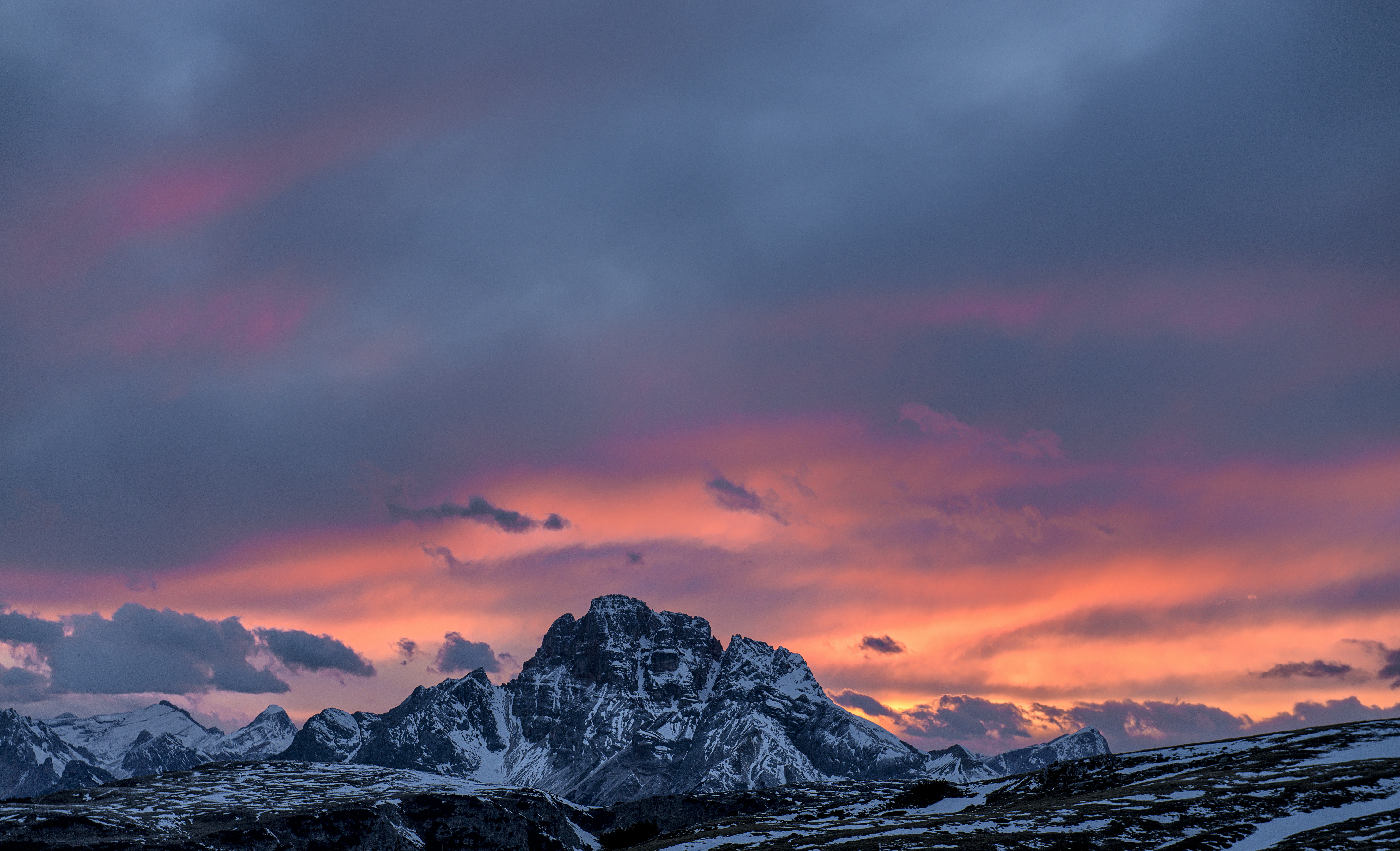 Sunset Over Snow-capped Mountains