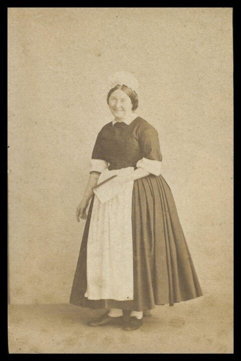Vintage full-body portrait of a maid