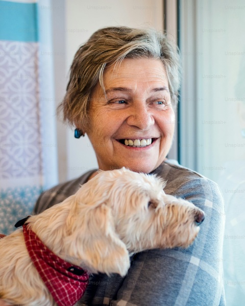 Senior Woman Holding Her Pet Dog