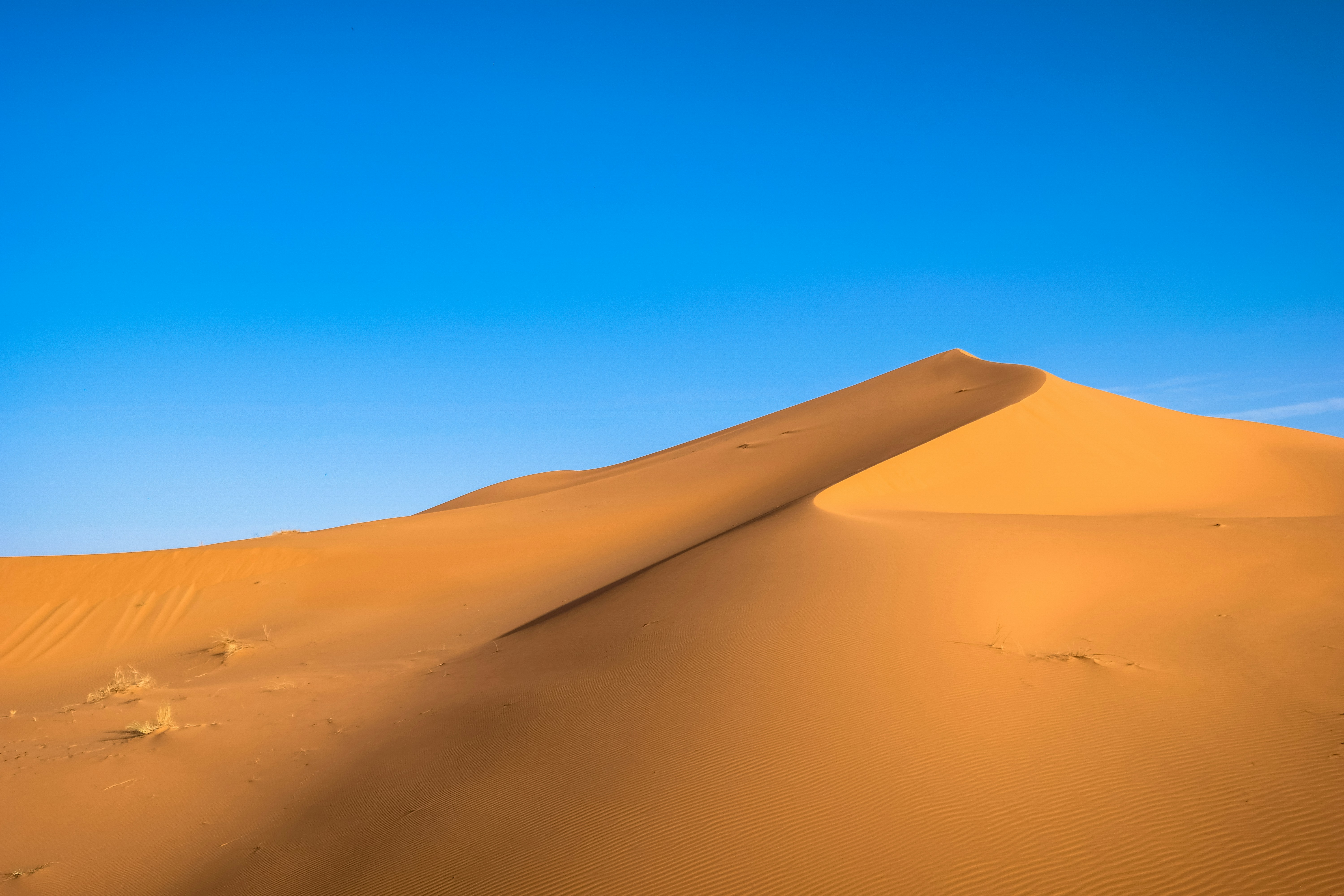 Desert Sand Dune Under Clear Sky