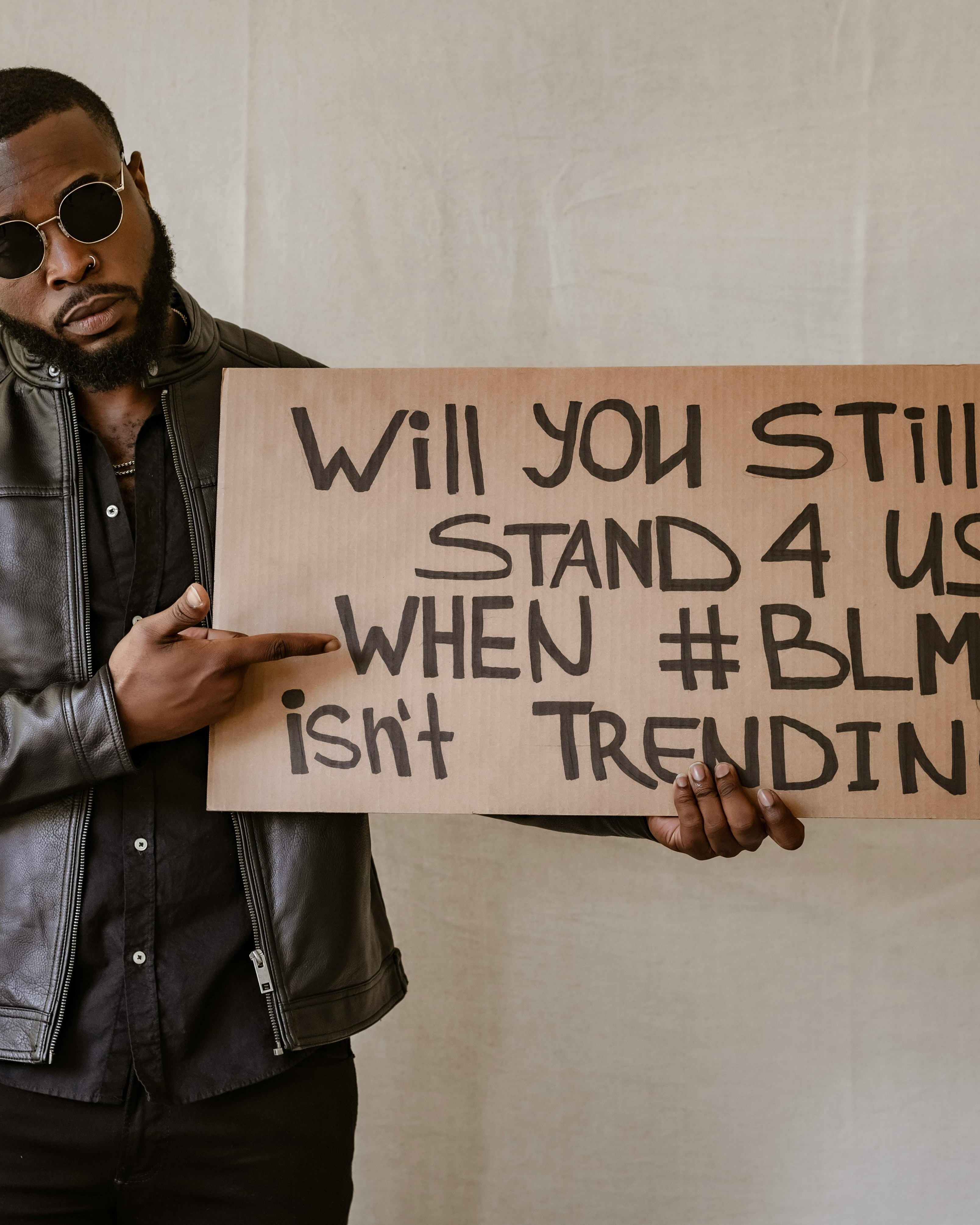 Black Man Holding BLM Protest Sign