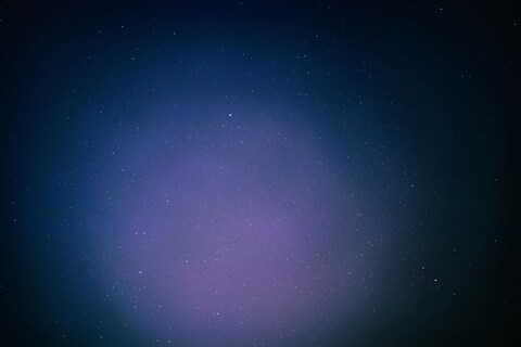Starry Night Sky With Purple Glow