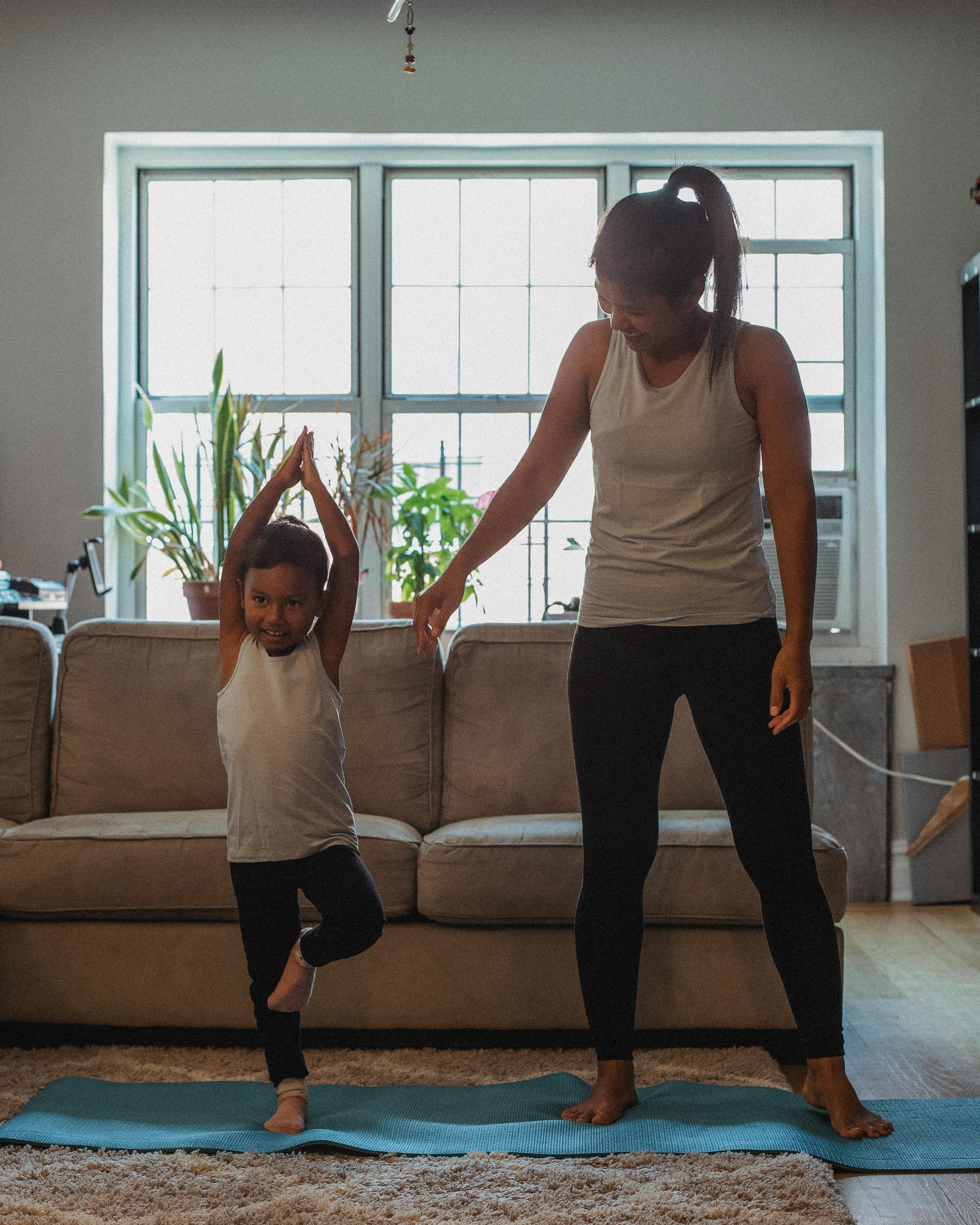 Mother and Daughter Doing Yoga at Home — Fitness