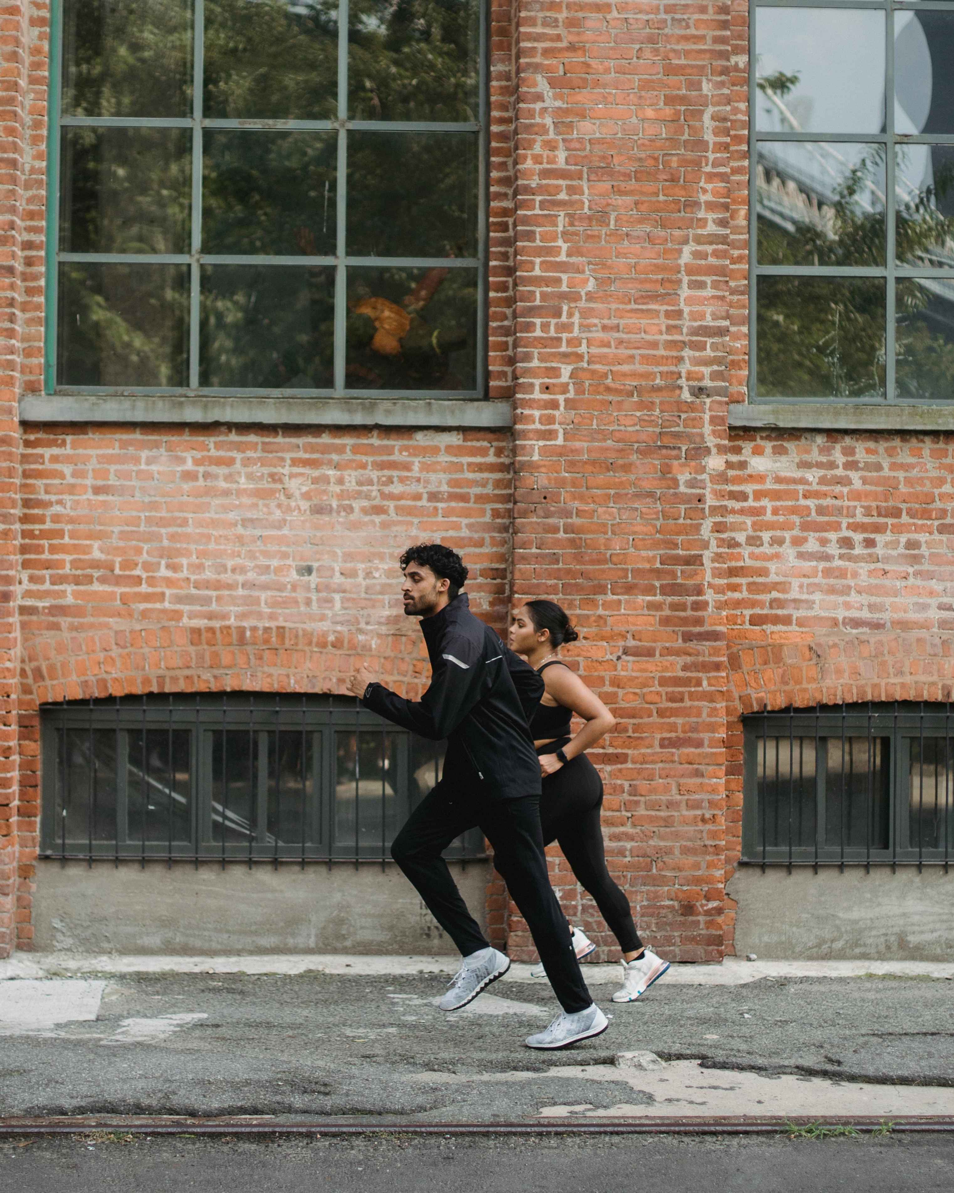 Two Joggers Running Outdoors