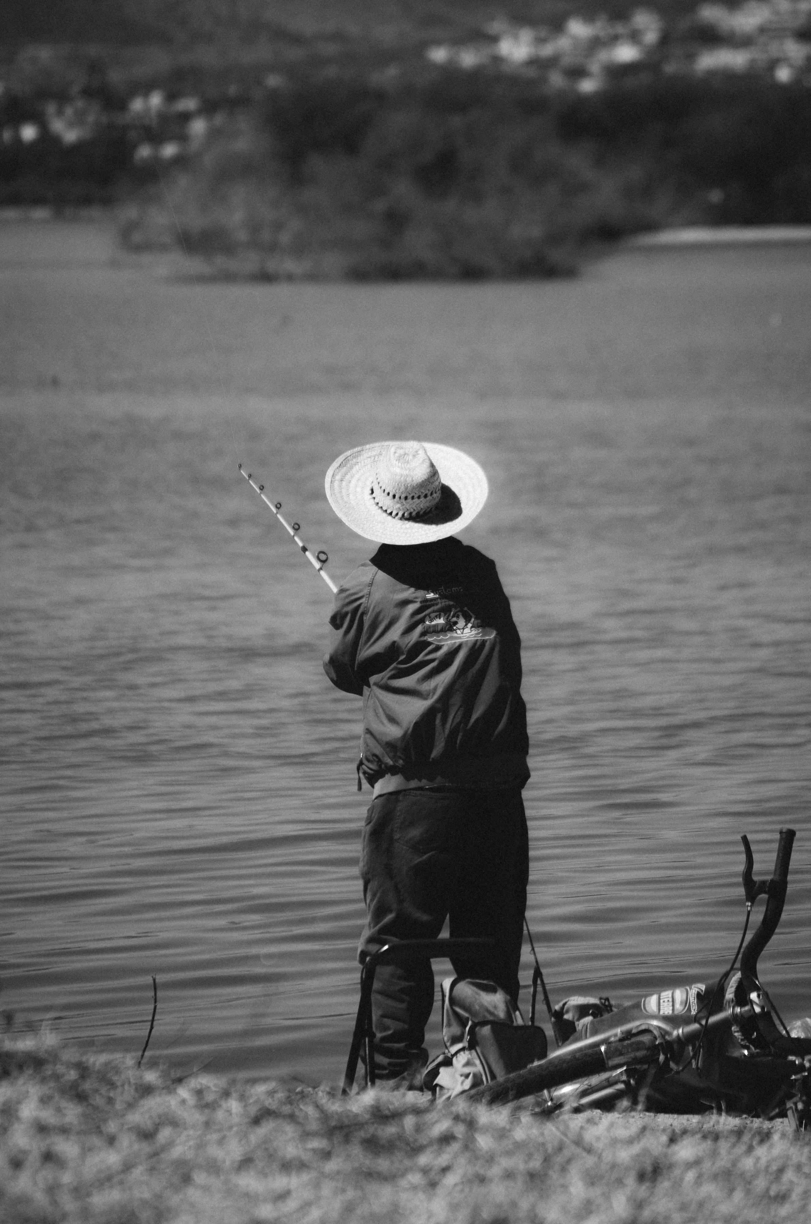 Fisherman Fishing by the Lake