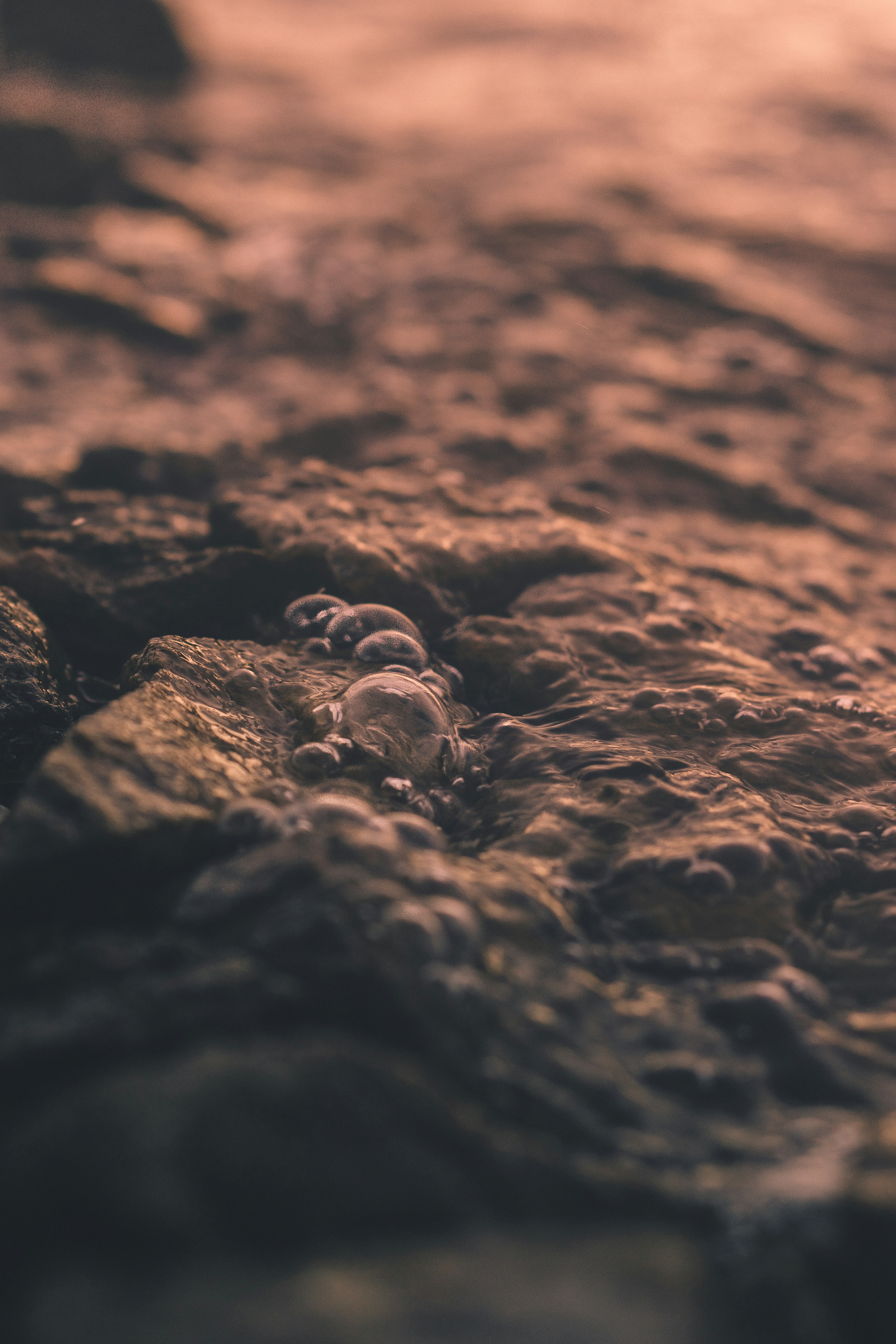 Water Bubbles on River Rocks