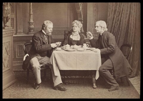 Three Victorian People Taking Tea