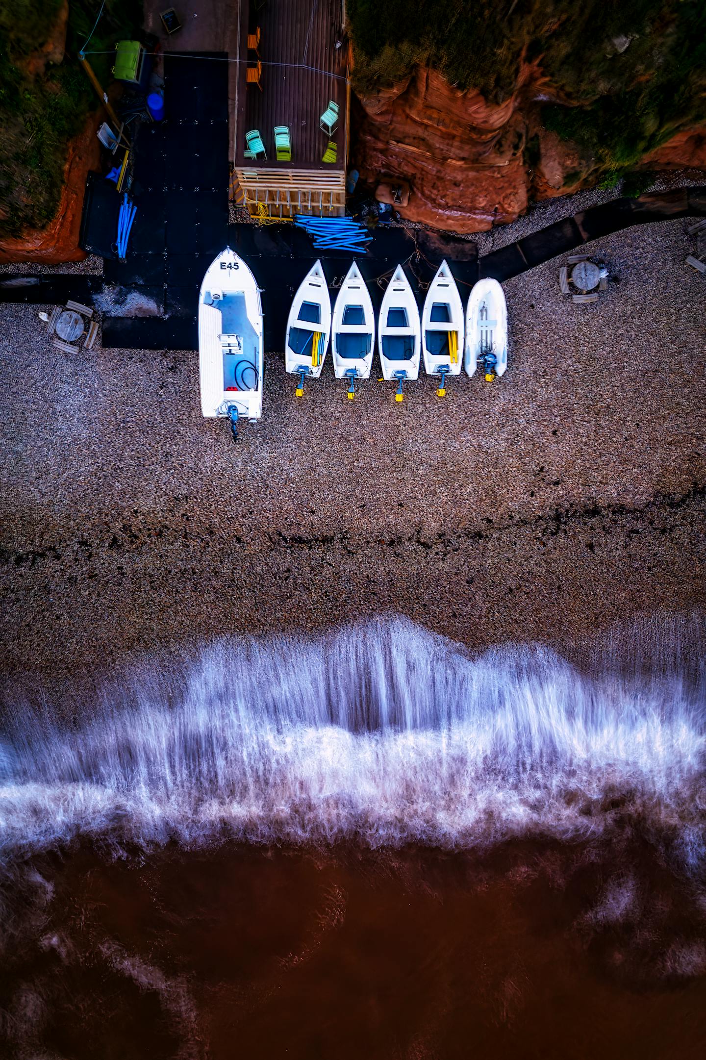 Aerial View of Boats on Pebbly Beach