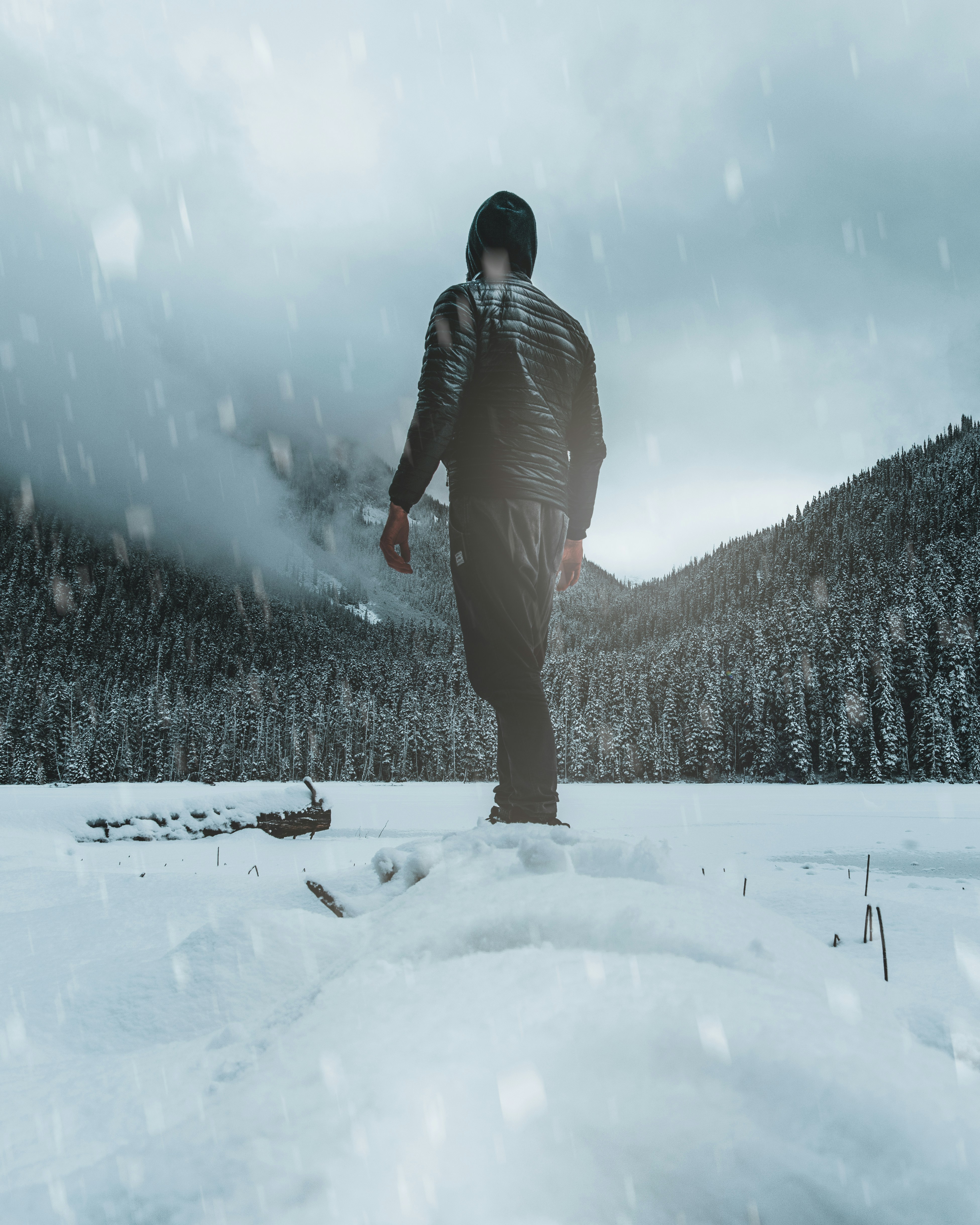 Hooded Man in Snowy Wilderness