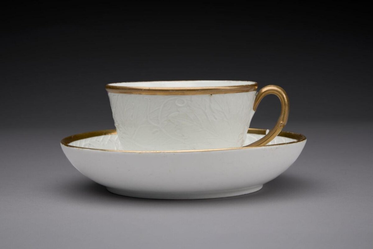 White Teacup and Saucer with Gold Trim