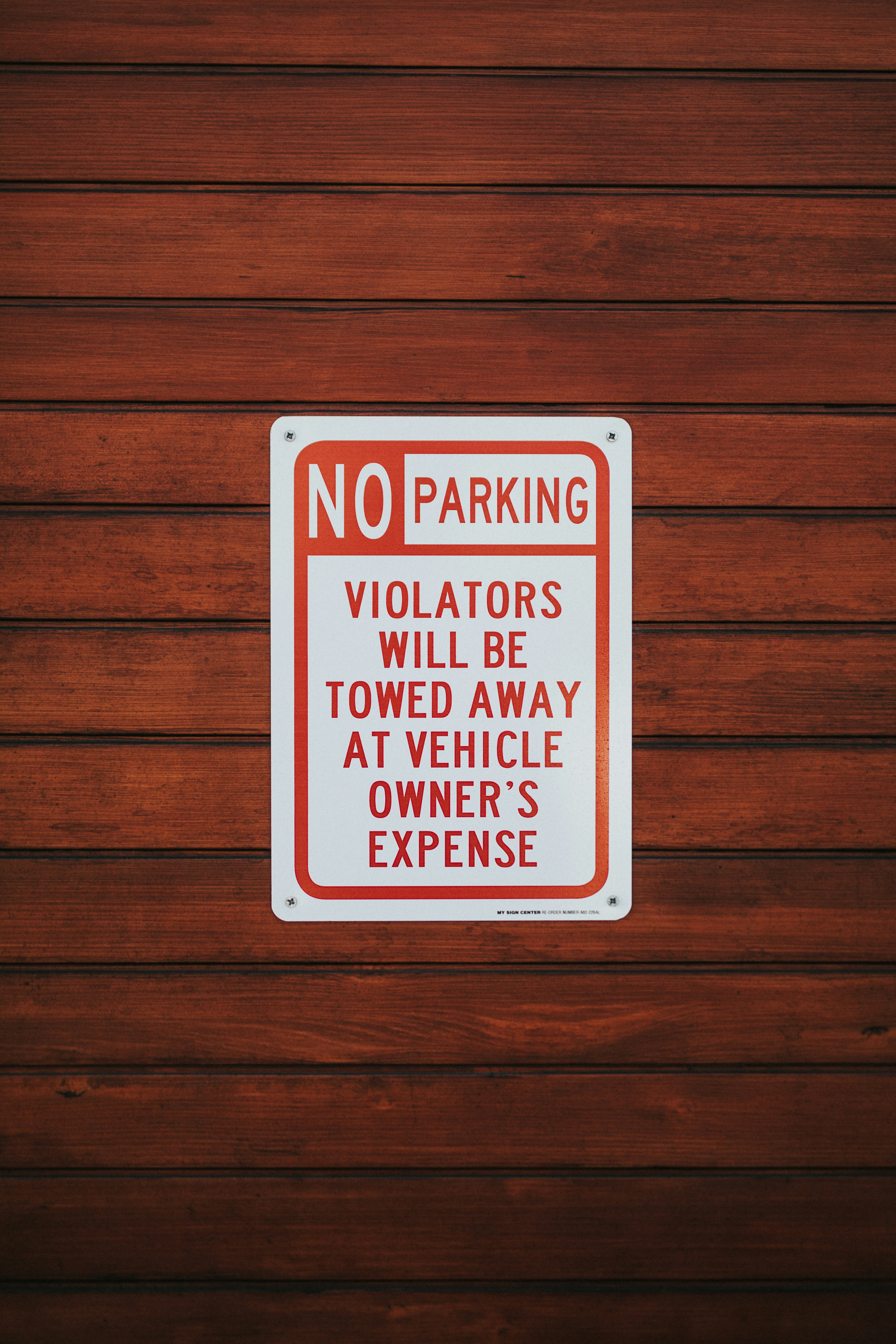 No Parking Sign On Wooden Wall