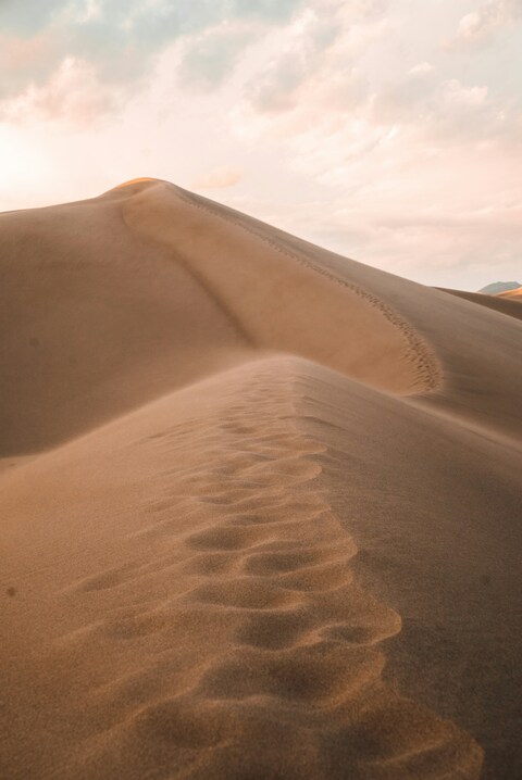 Footsteps on Desert Sand Dunes