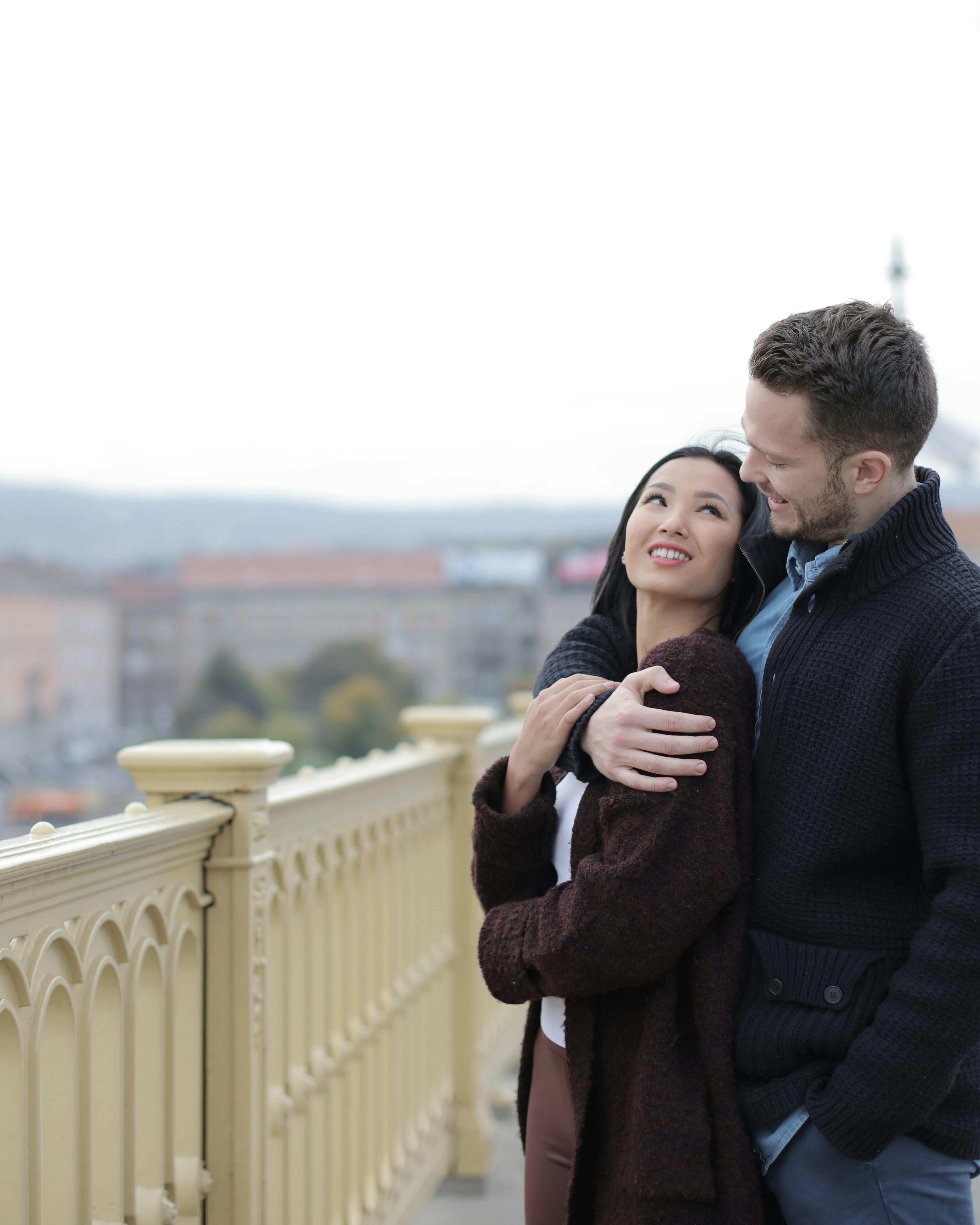 Loving Couple Embracing on City Overlook