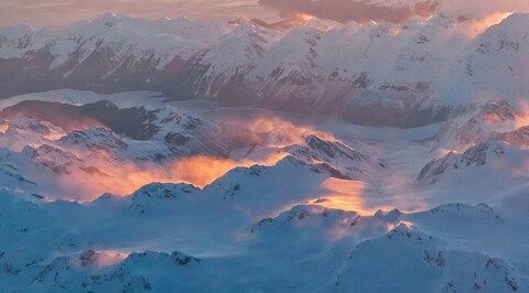 Sunset Over Snowy Mountain Range