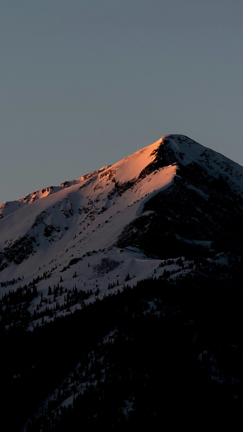 Sunlit Snowy Mountain Peak