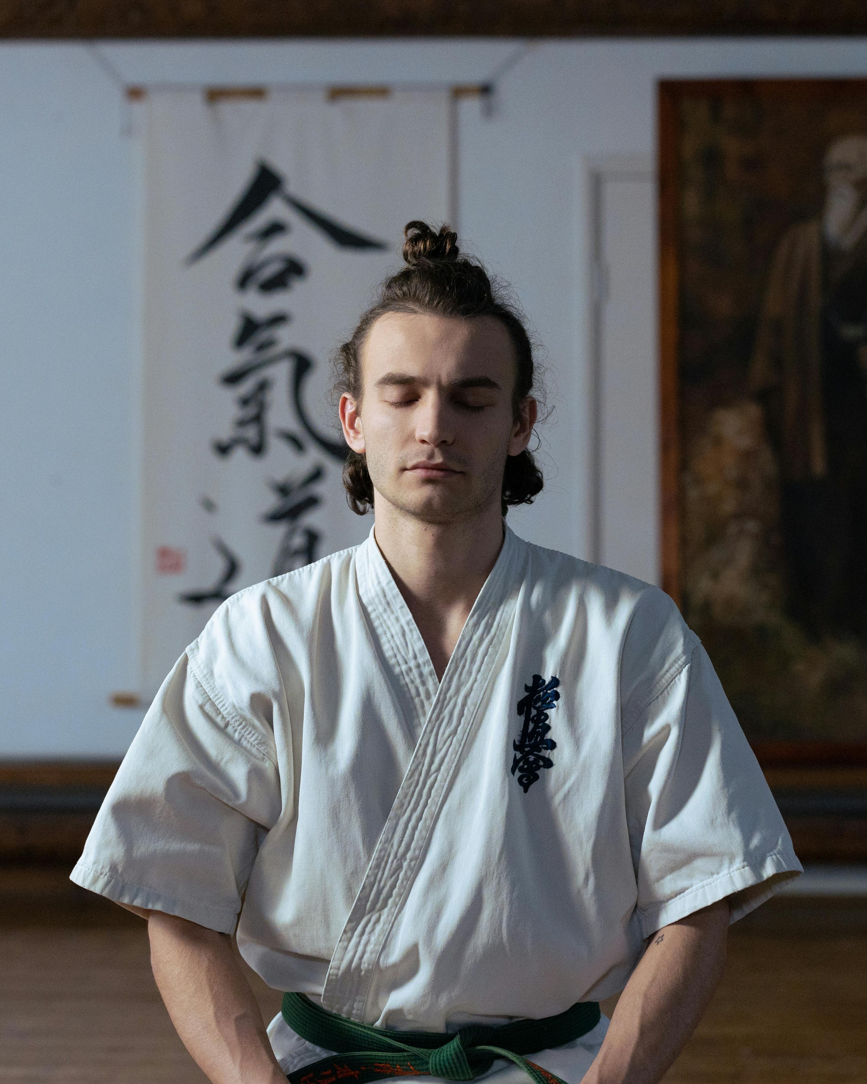 Aikido Practitioner Meditating in Dojo