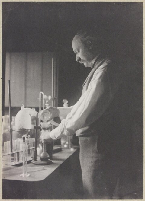 Chemist Conducting Experiment in Lab