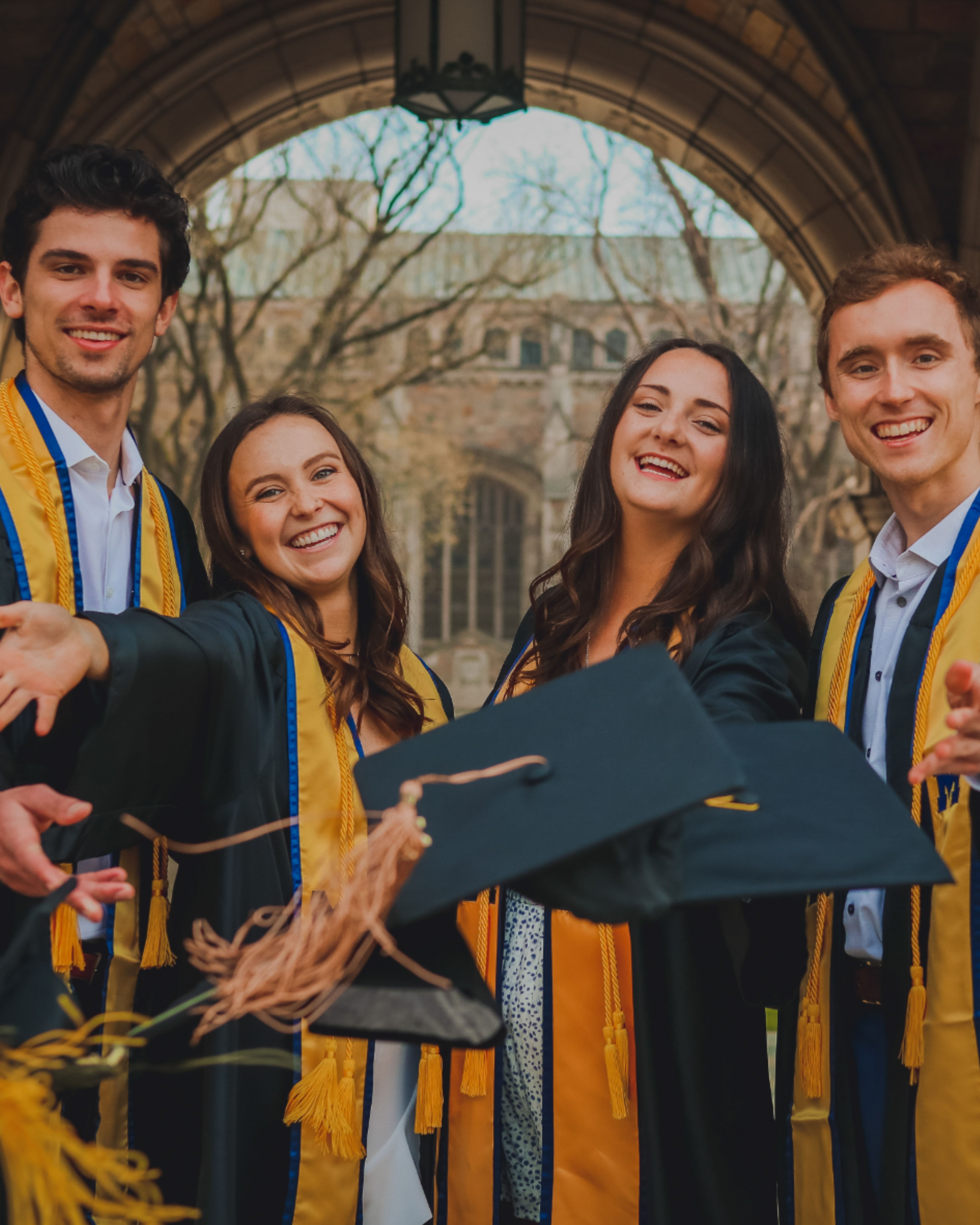 Four University Graduates Celebrating Graduation