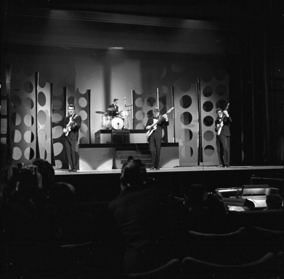 Four-member Band Performing On Stage