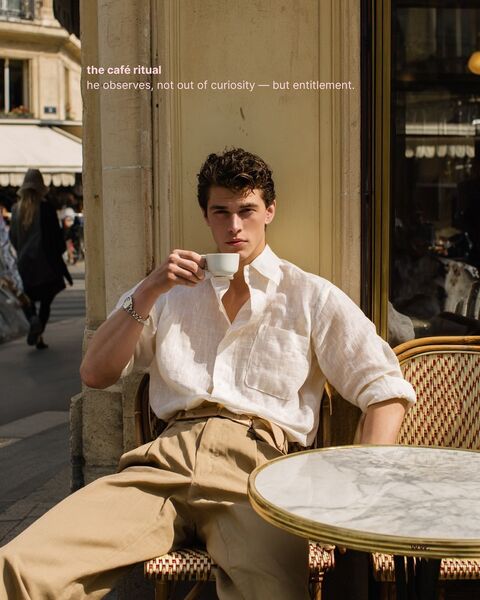 Man Enjoying Coffee at Street Cafe