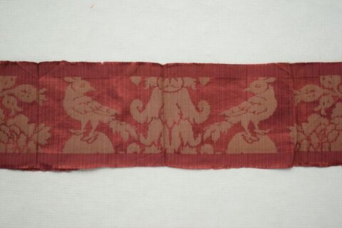 Red Textile Fragment with Bird Patterns