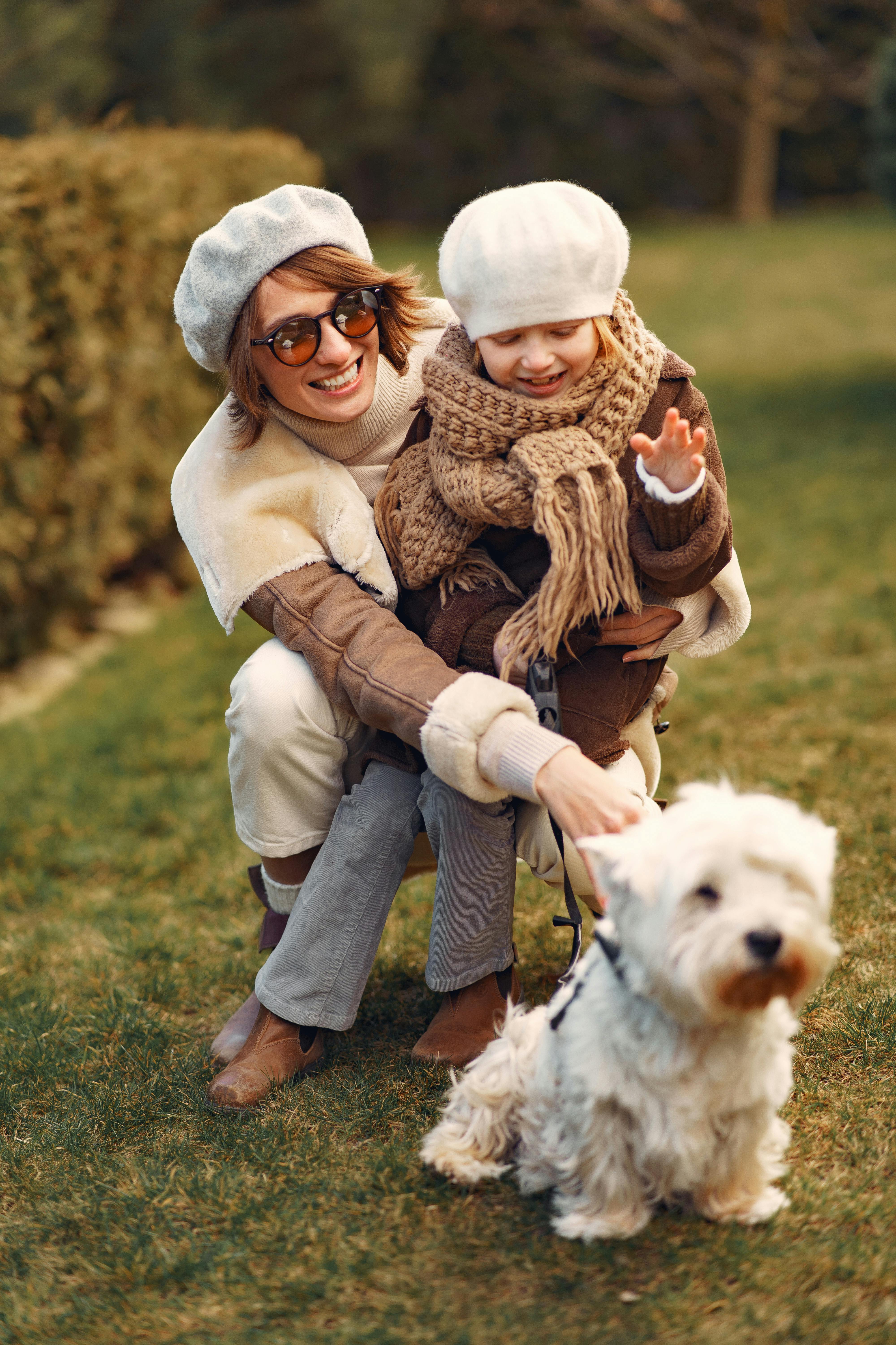 Woman, child and dog in park