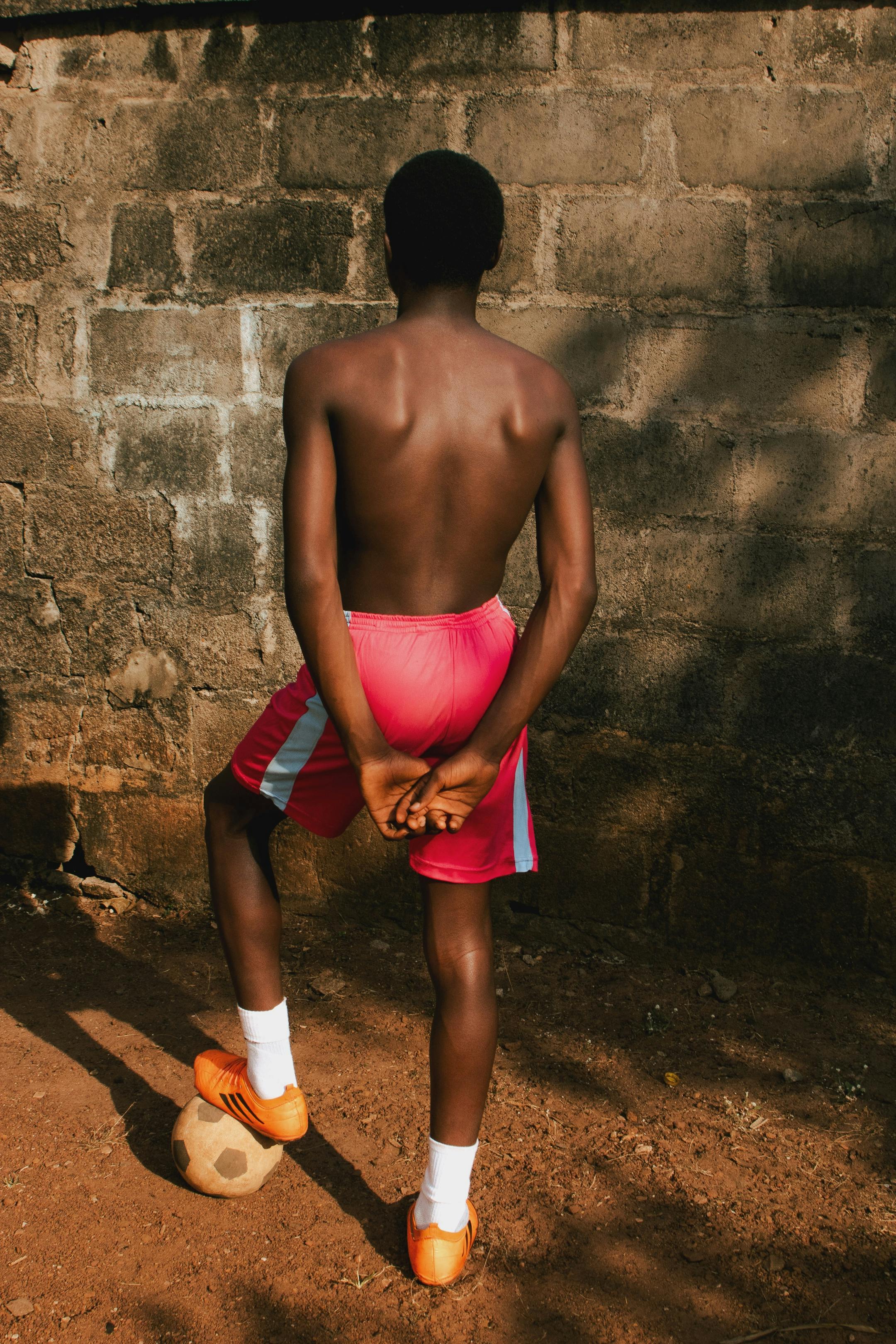 Shirtless Young Soccer Player From Behind